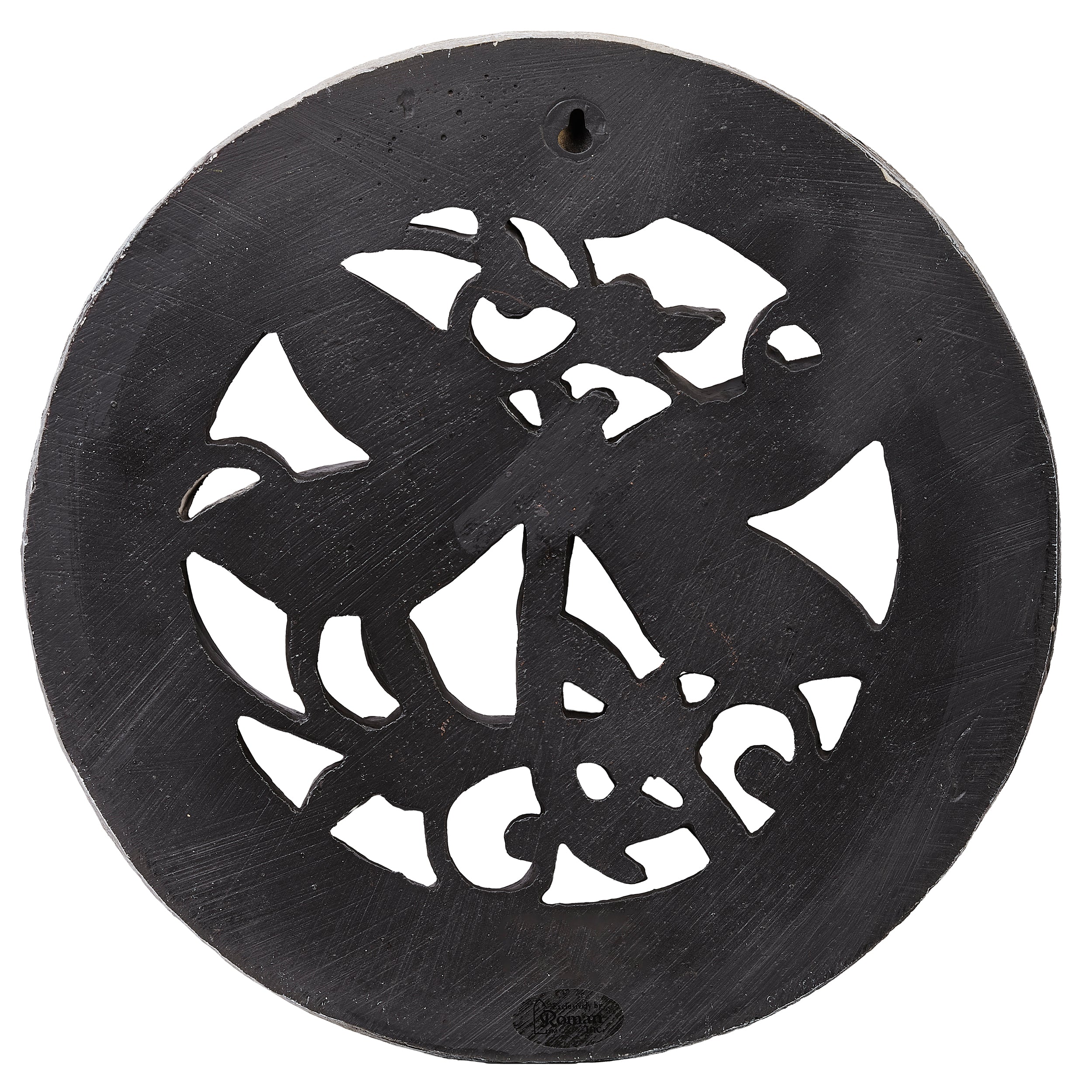 Decorative metal plate with cut-out design on a white background