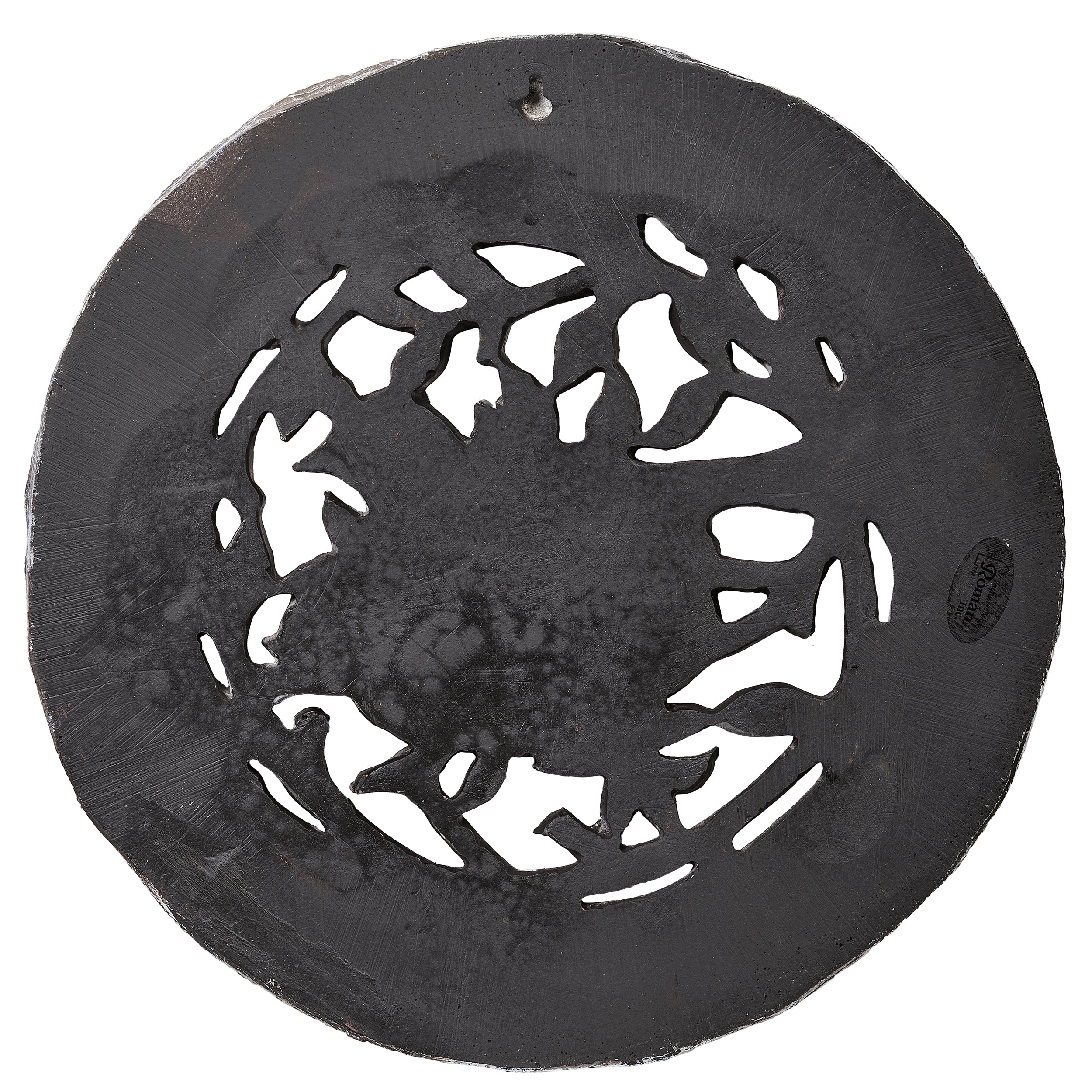 Decorative metal plate with cut-out design on a white background