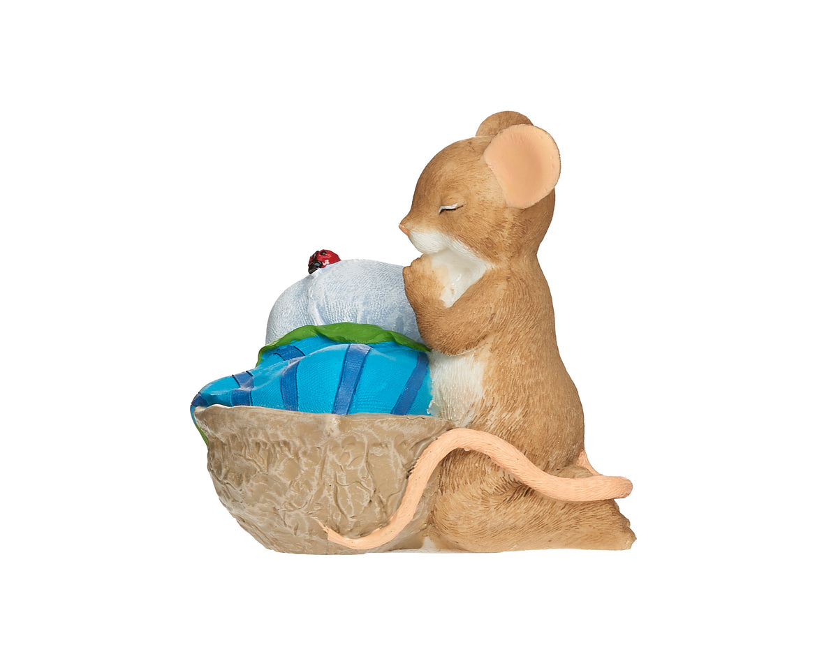 Opposite side view of Charming Tails Bedtime Prayers figure showing the mouse kneeling beside the cozy walnut shell bed