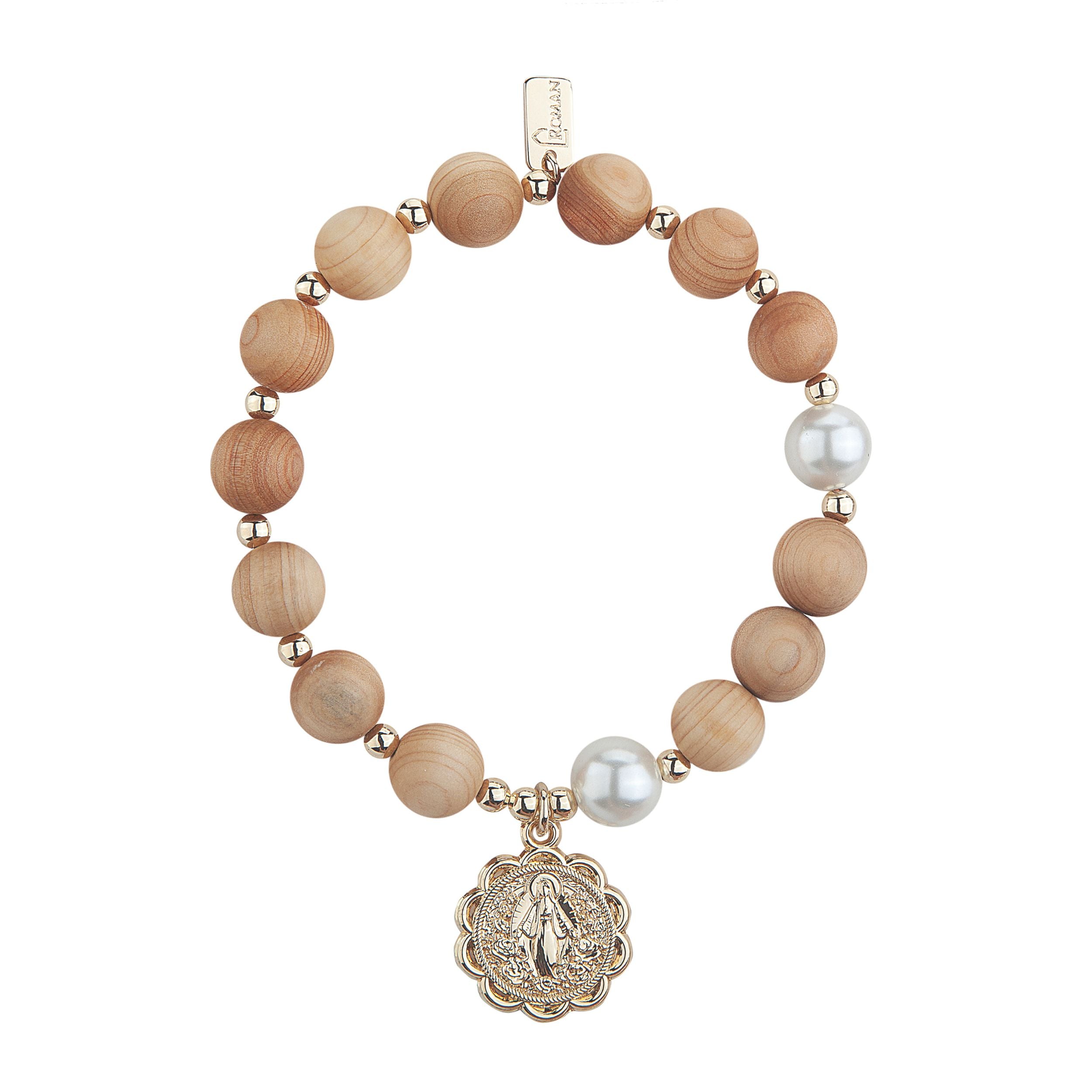Bracelet with wooden beads and a religious charm on a white background
