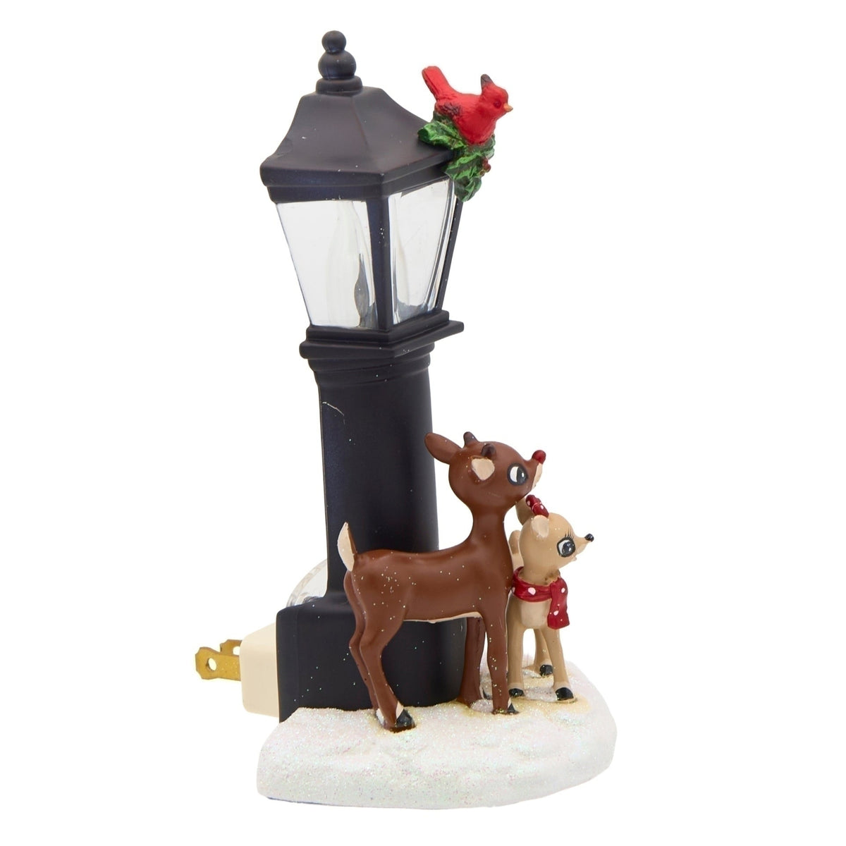 Side view of Rudolph and Clarice lamppost night-light showing the black lantern, snowy base, and extended plug prongs.