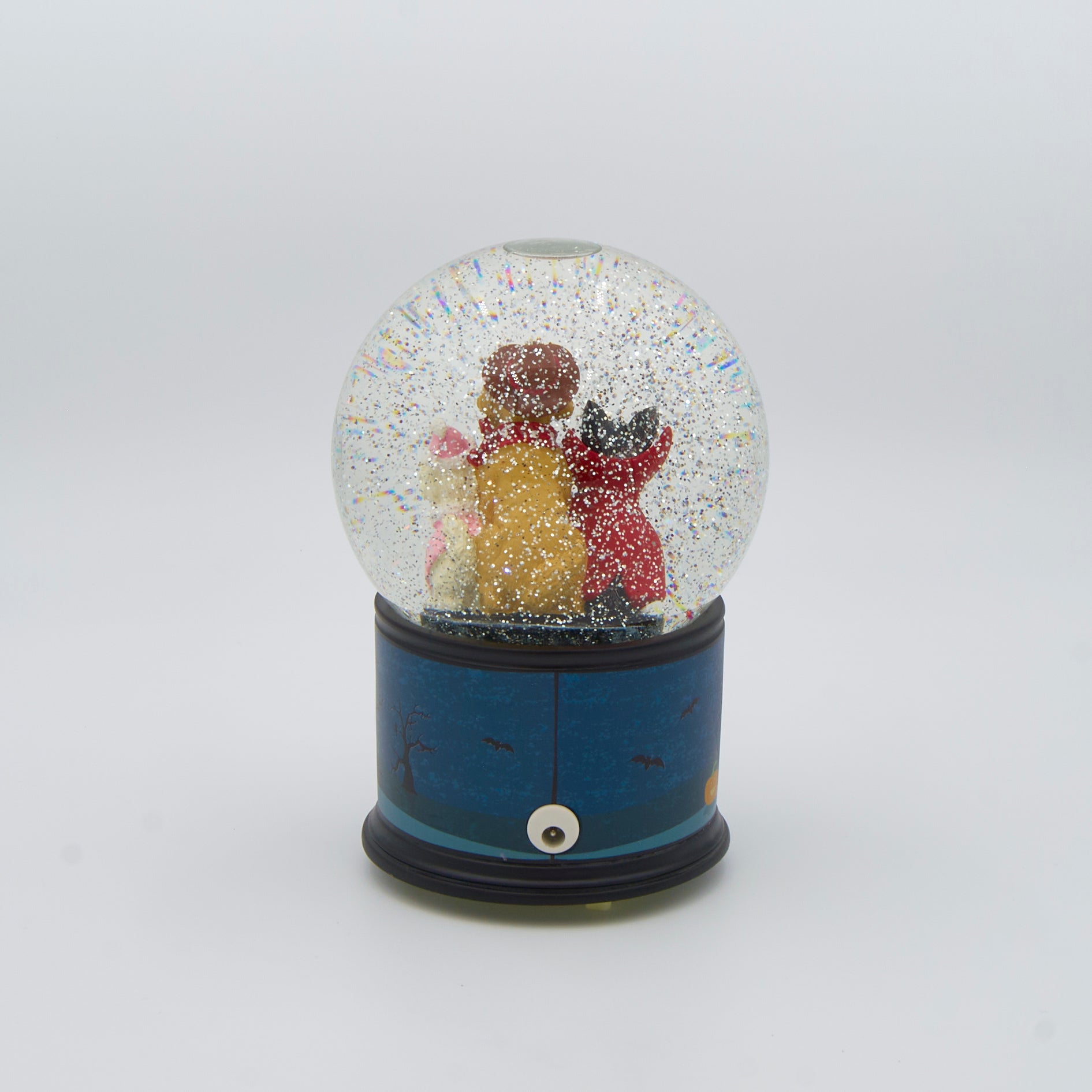 Halloween-themed glitterdome with three dogs wearing costumes inside