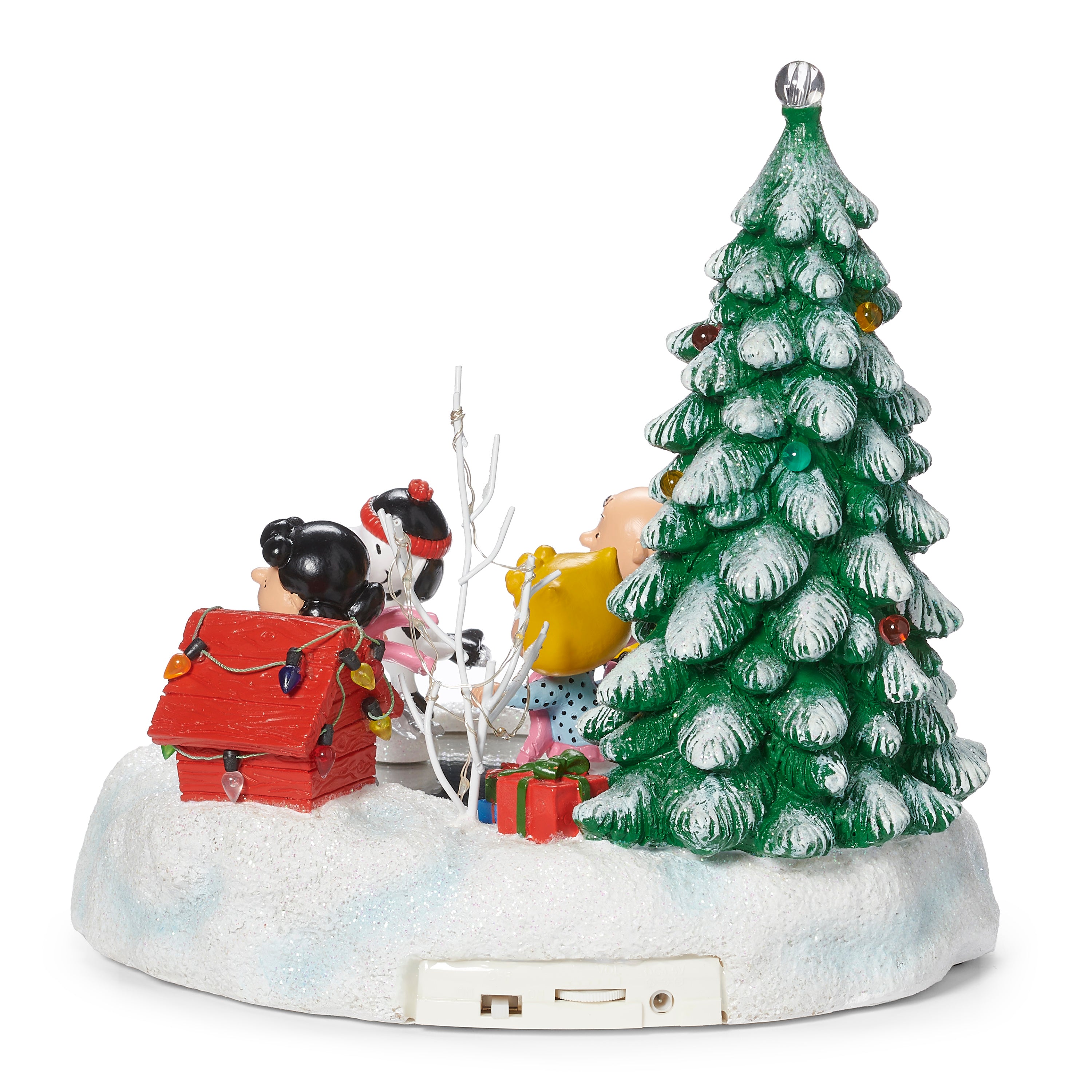 peanut characters ice skating in front of a christmas tree