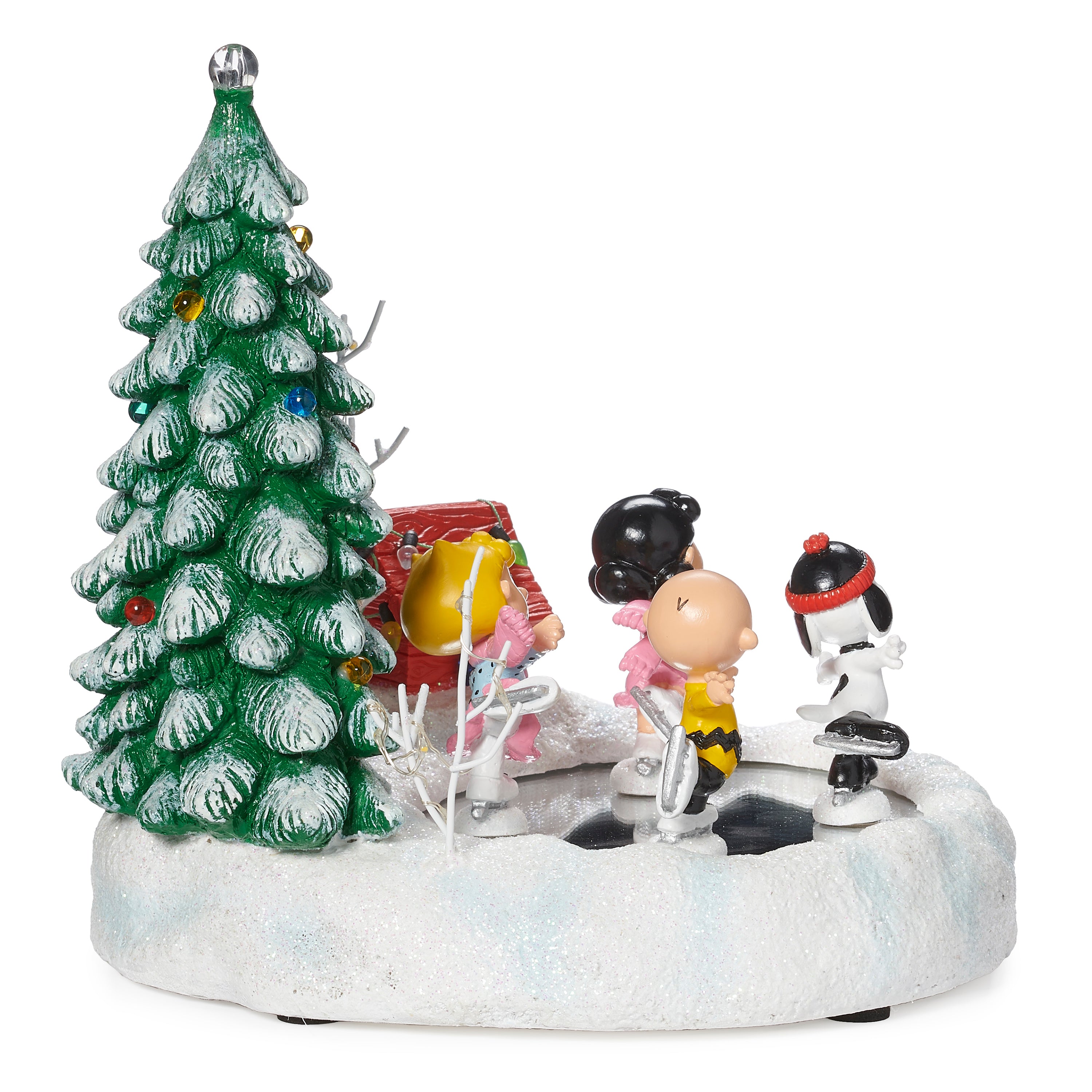 peanut characters ice skating in front of a christmas tree