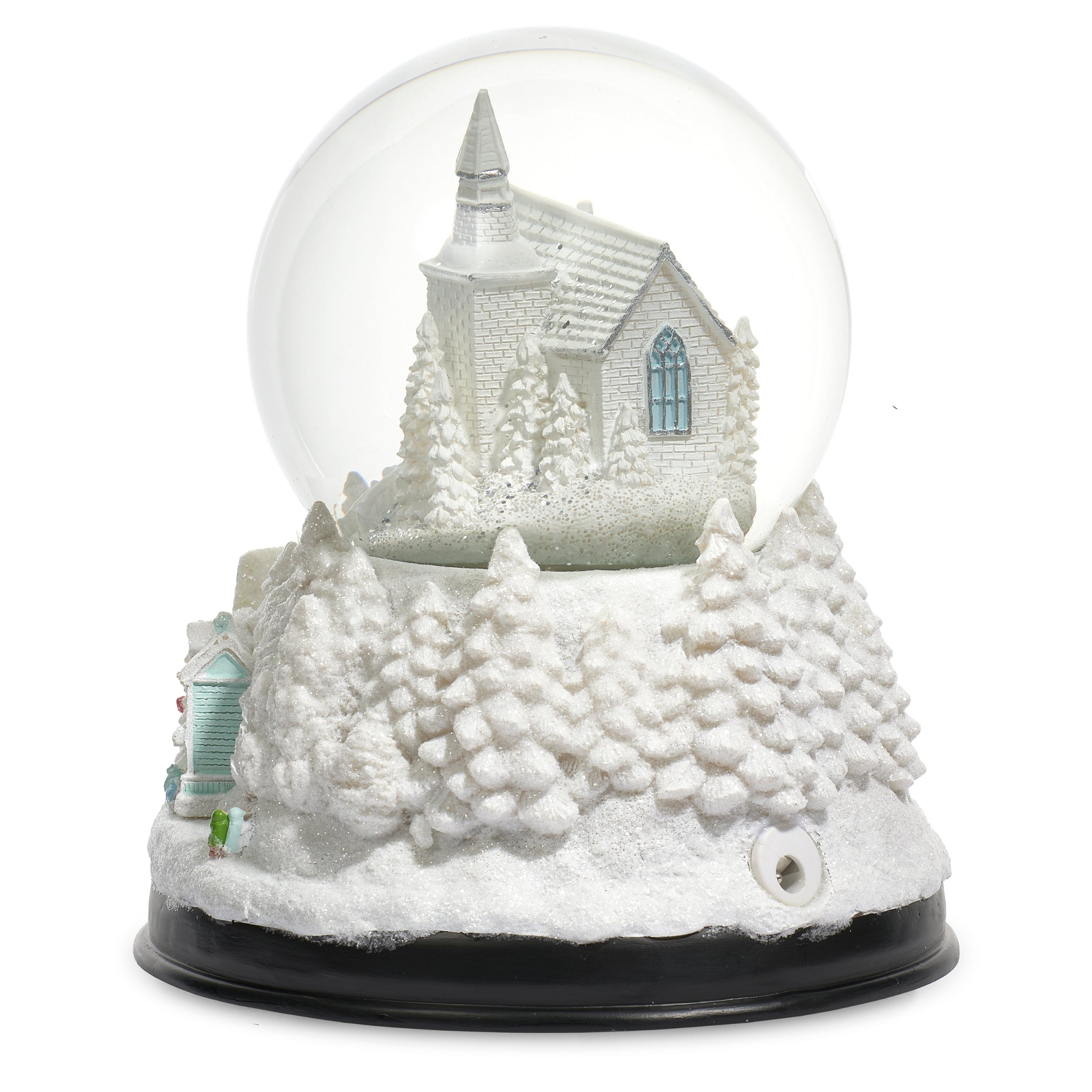 Snow globe with a winter scene featuring a church and trees on a white background