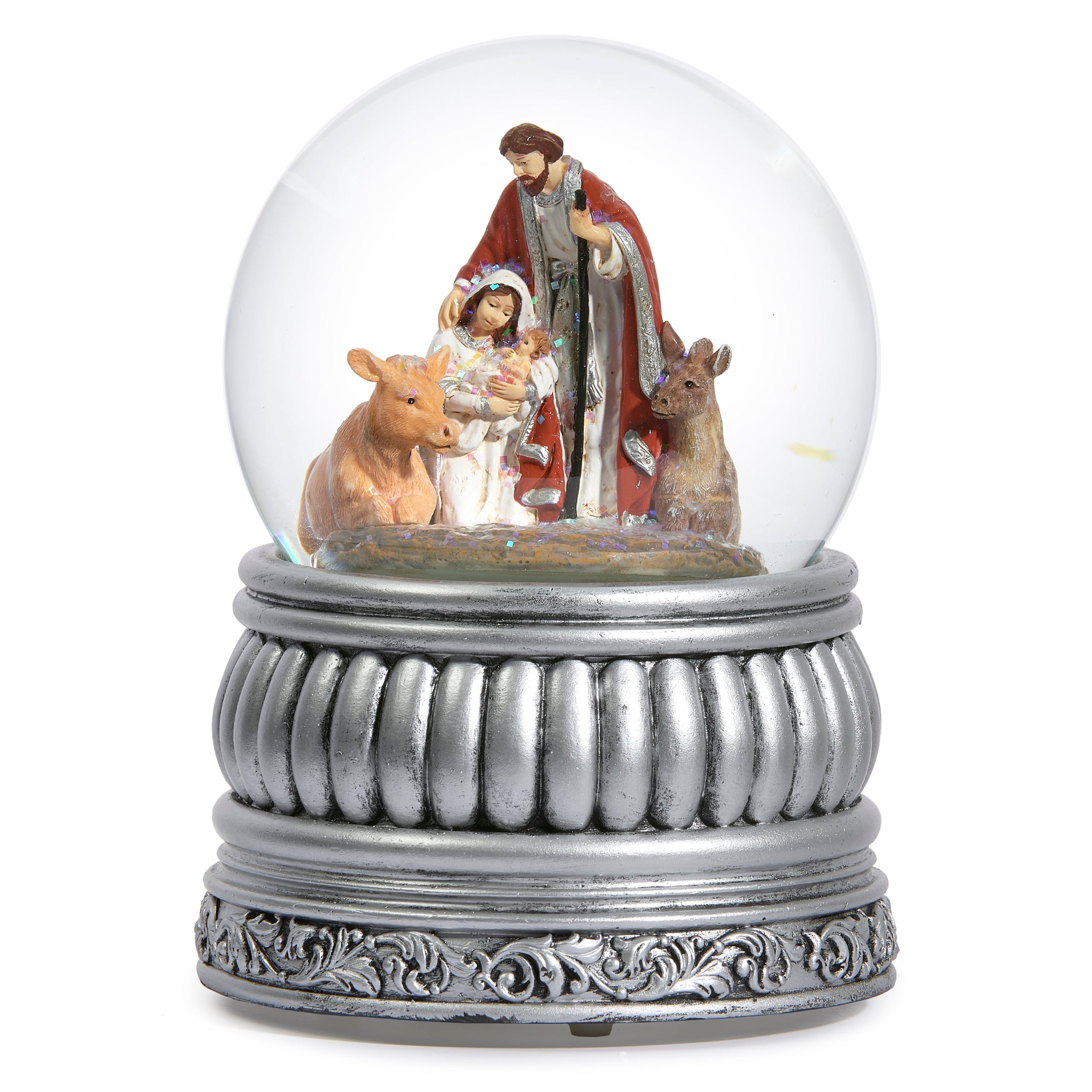 Nativity scene inside a snow globe with a decorative base on a white background