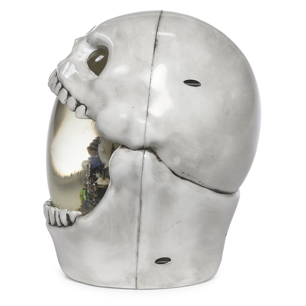 Side view of skull decoration showing its open jaw, rounded head, and gray shading.