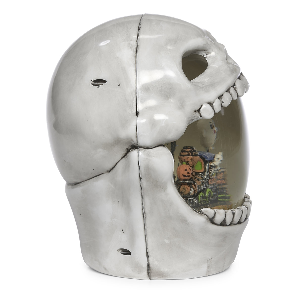 Opposite side view of skull decoration with the miniature haunted train visible inside its open mouth.