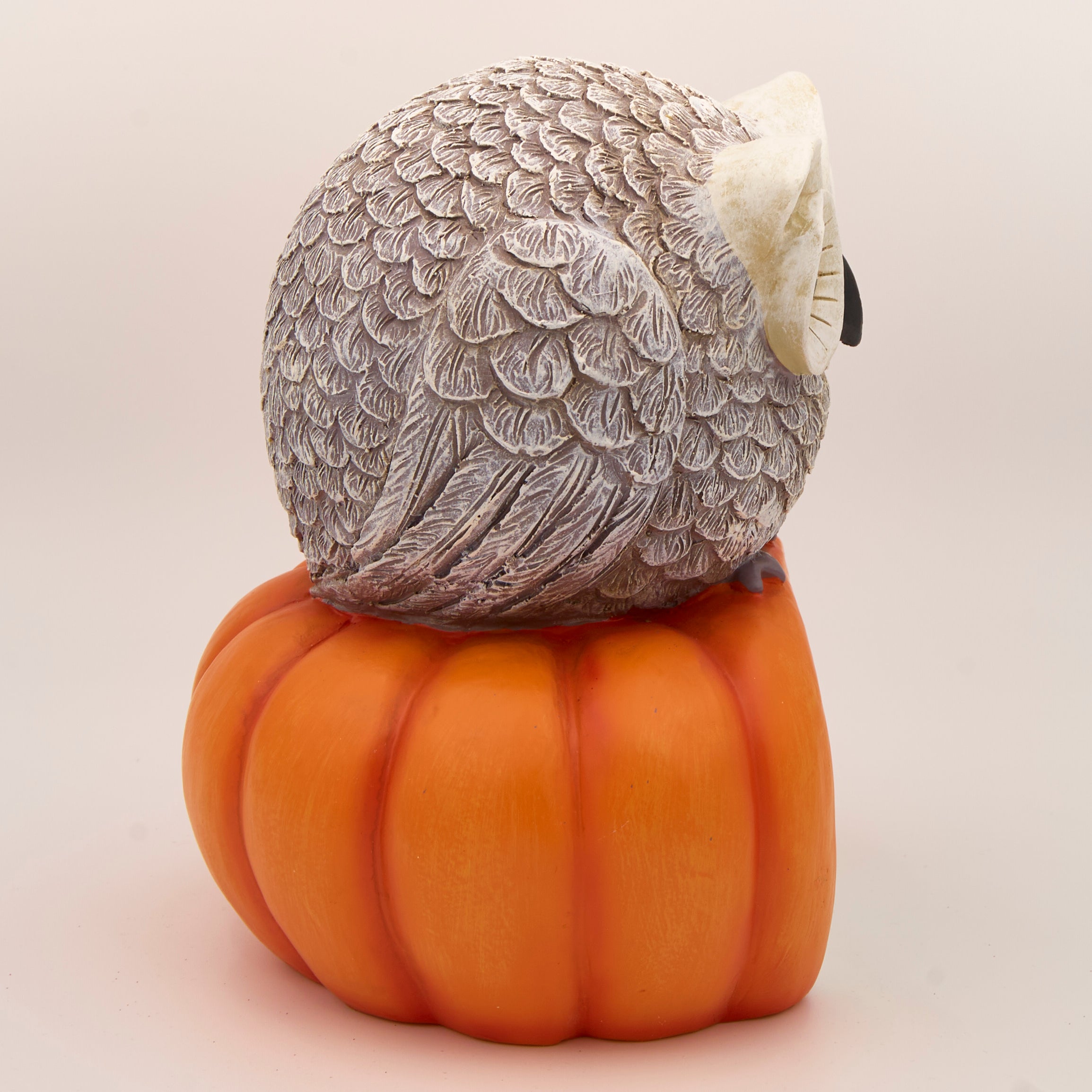 Decorative owl on a pumpkin