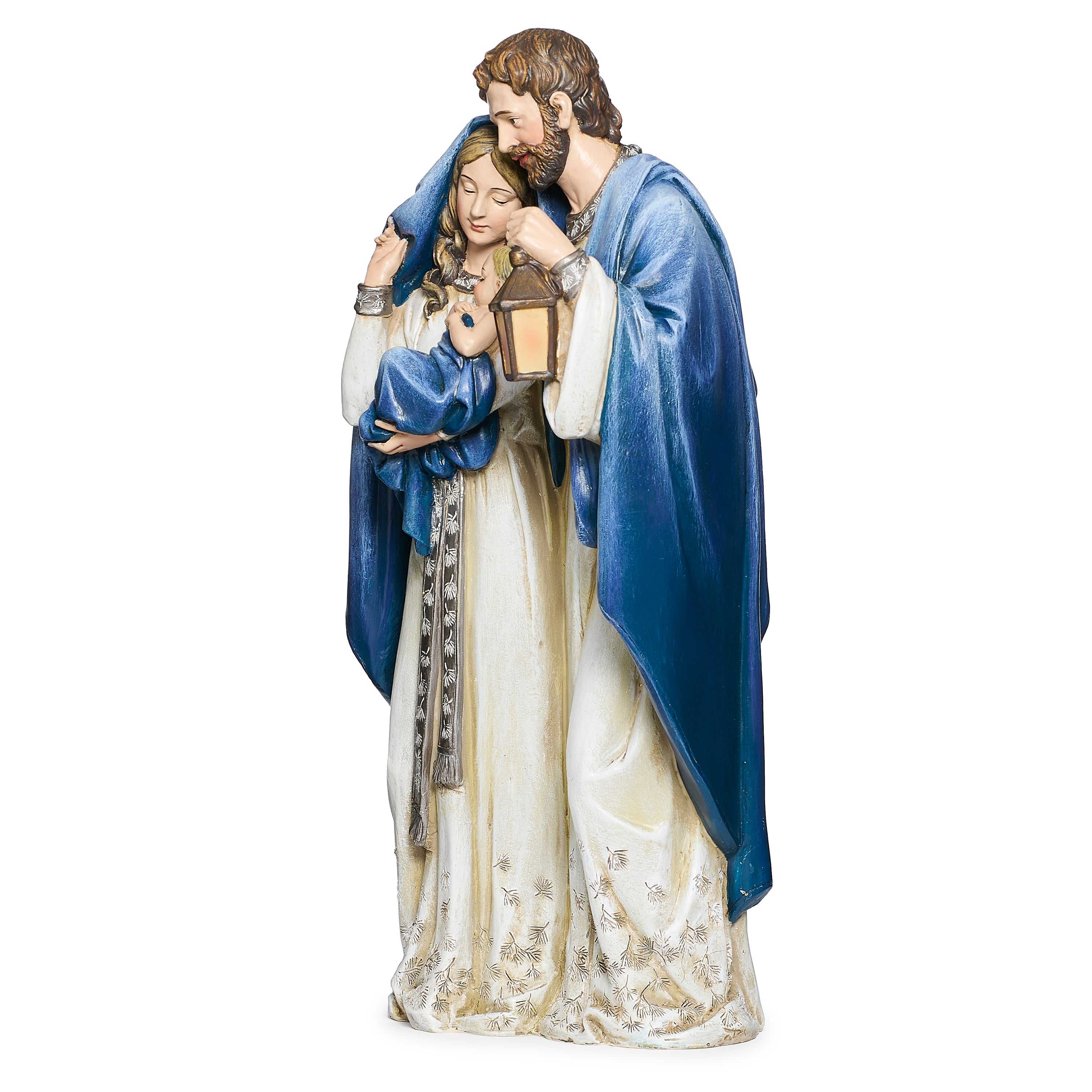 Statue of the holy family in blue and white robes holding a lantern on a white background