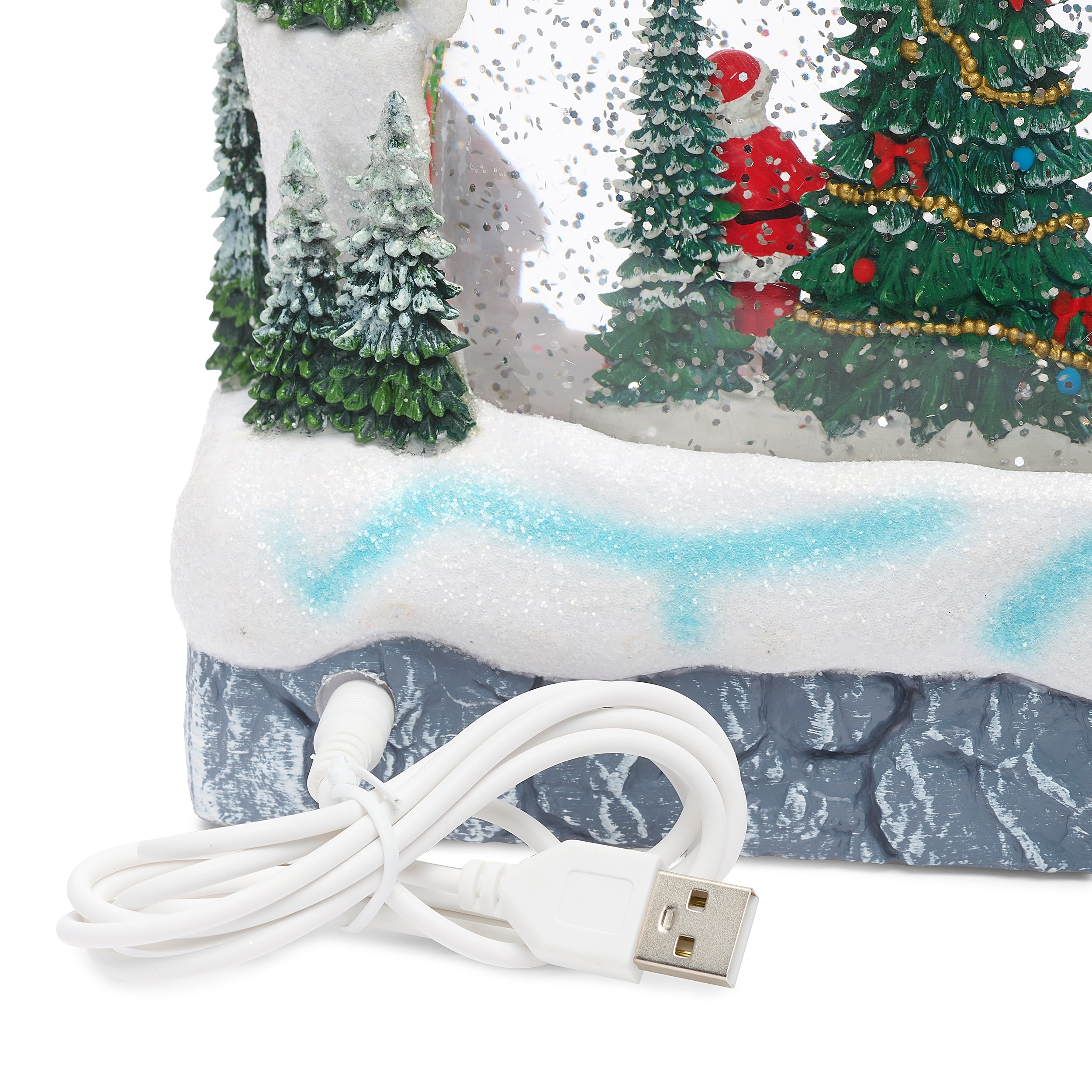 zoomed in view power cord plugged into Christmas decoration on a white background