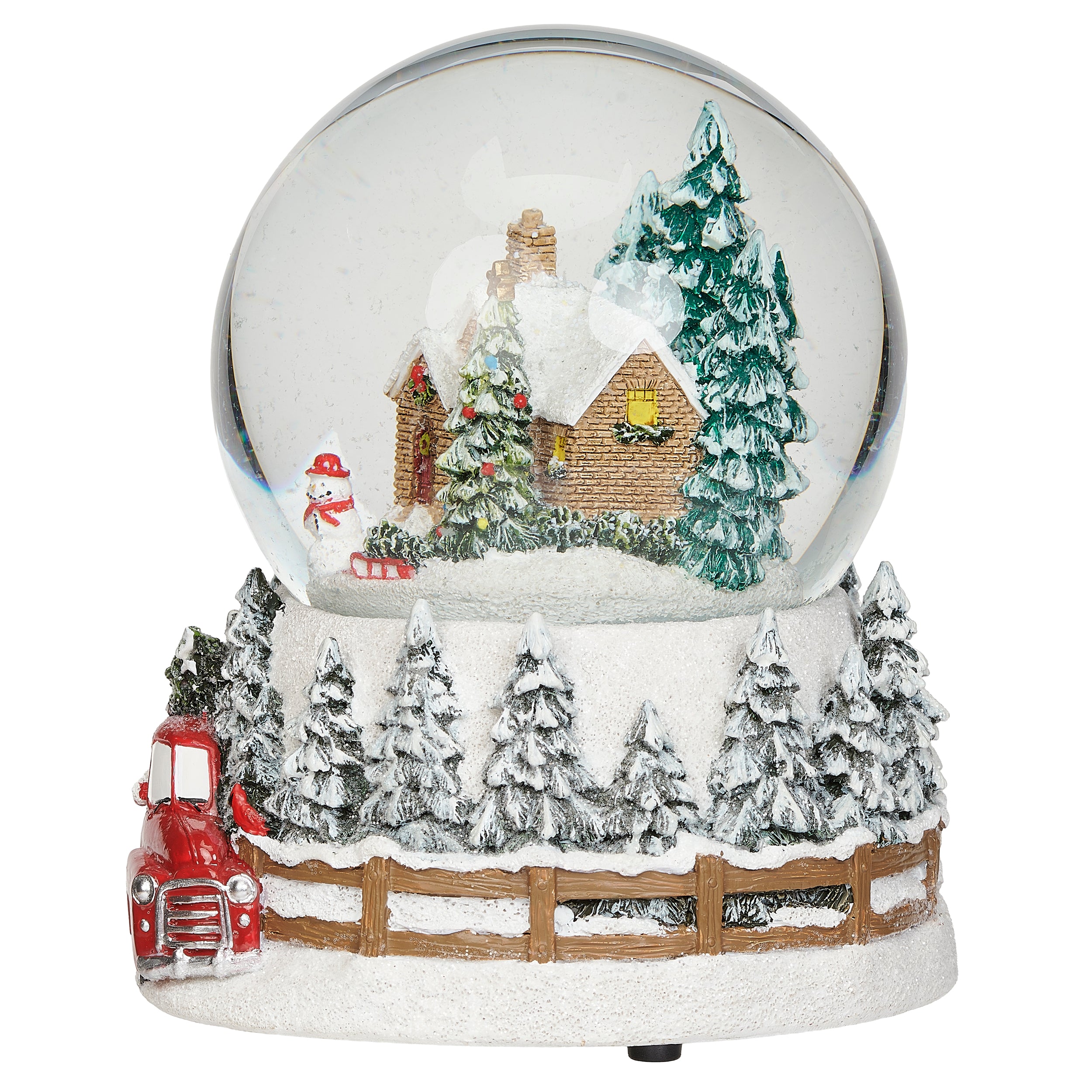 Snow globe with a winter scene featuring a house, trees, and a red truck on a white background.