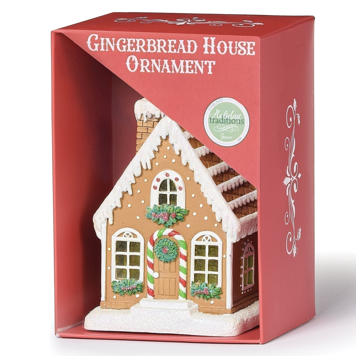 Gingerbread house ornament displayed in a red window box labeled “Gingerbread House Ornament.”