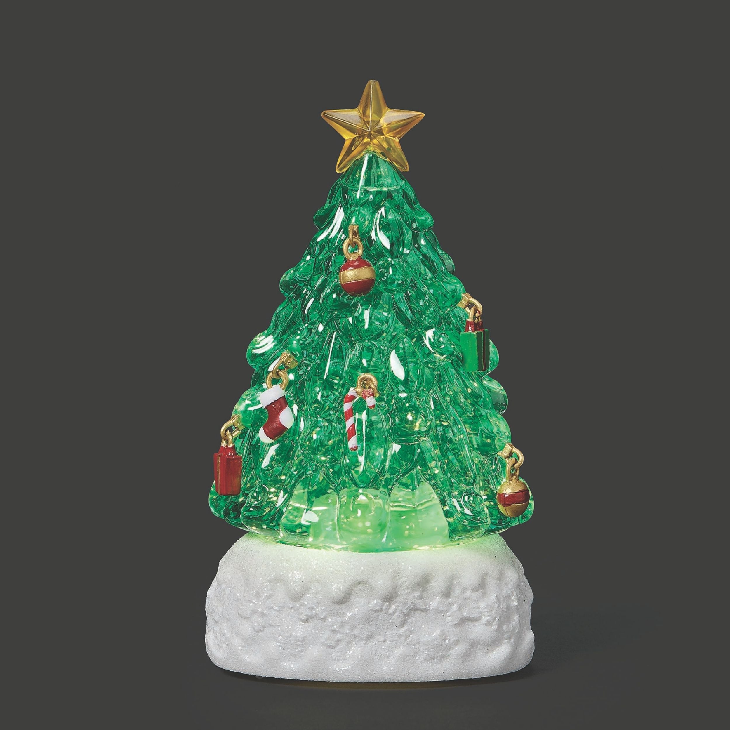 Decorative Christmas tree figurine with lights on a dark background