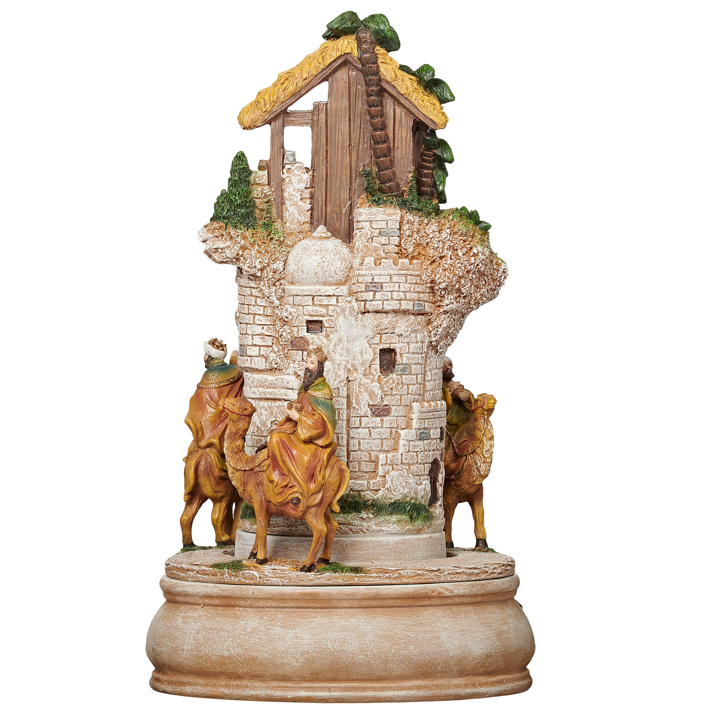 Decorative nativity scene figurine with stable and figures on a white background