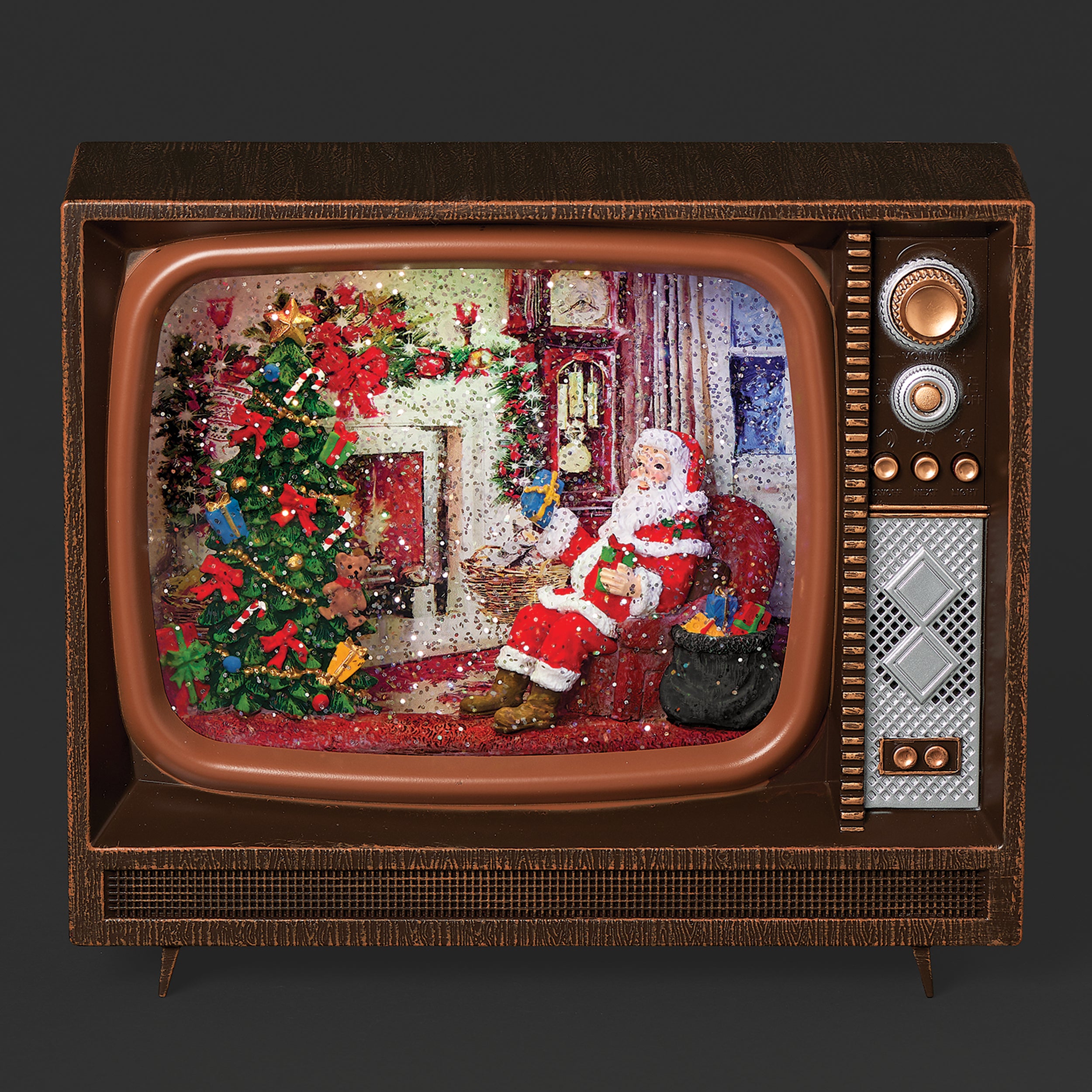 Vintage television set displaying a Christmas scene with Santa Claus and a decorated tree.