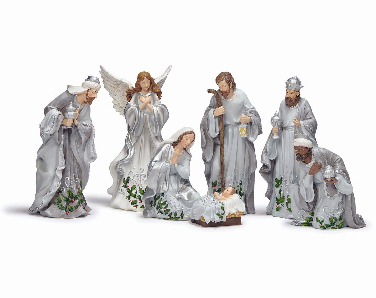 Set of nativity scene figurines on a white background