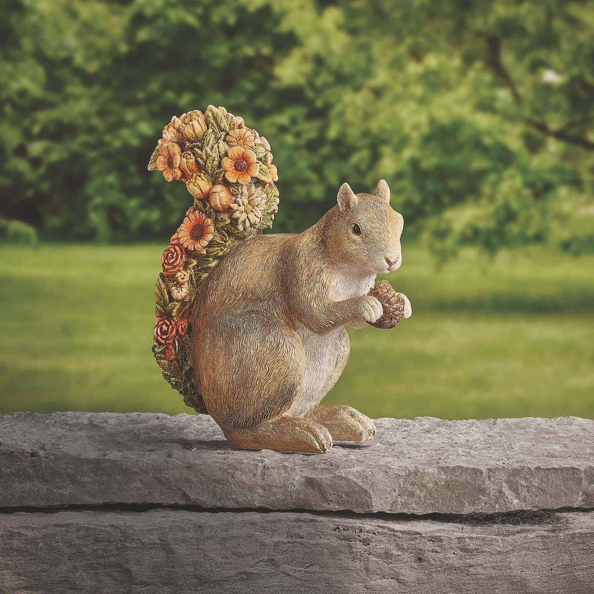 Squirrel with Flower Tail garden statue displayed outdoors