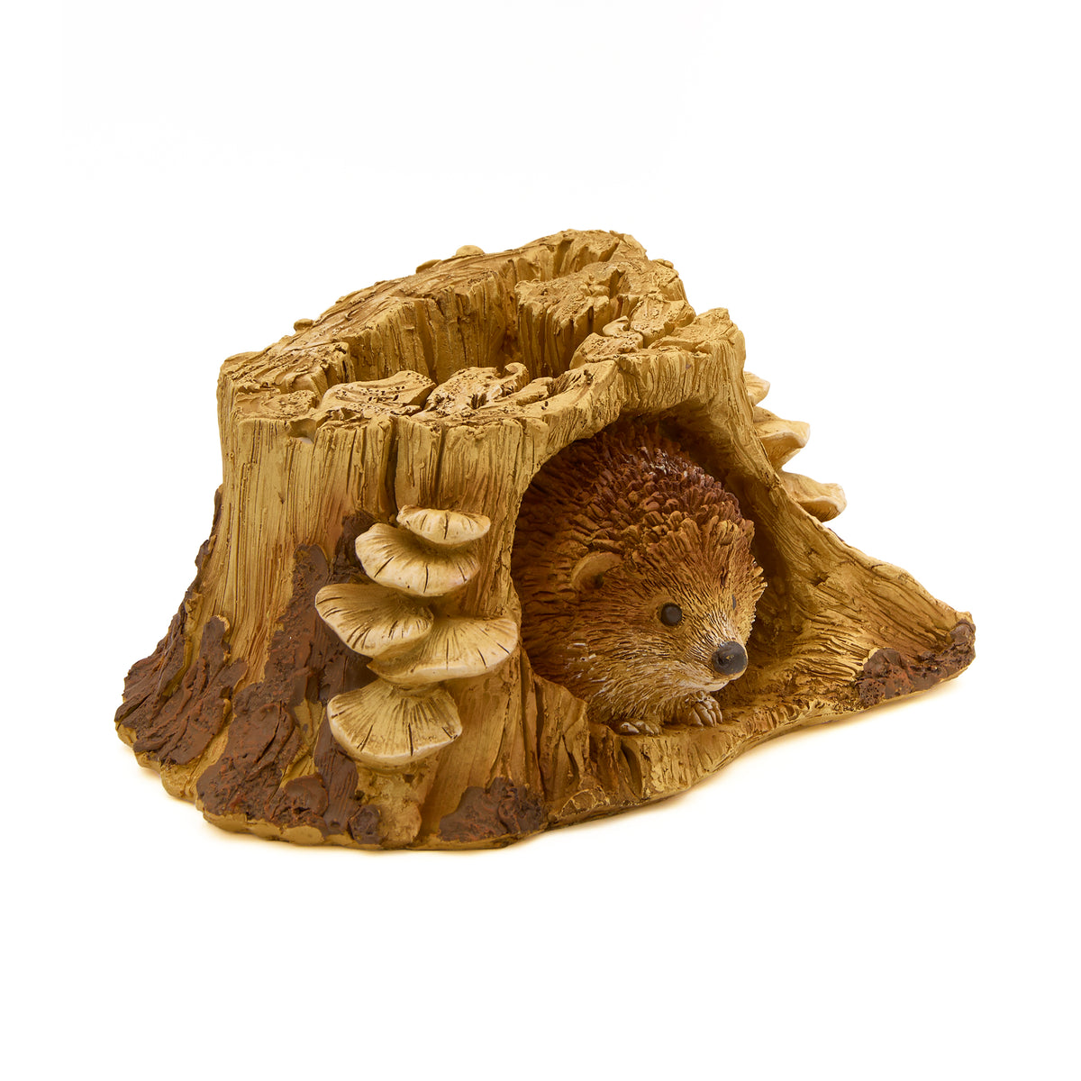Front angled view of Hedgehog in Tree Stump Garden Statue showing the hedgehog tucked inside the textured stump and mushroom details