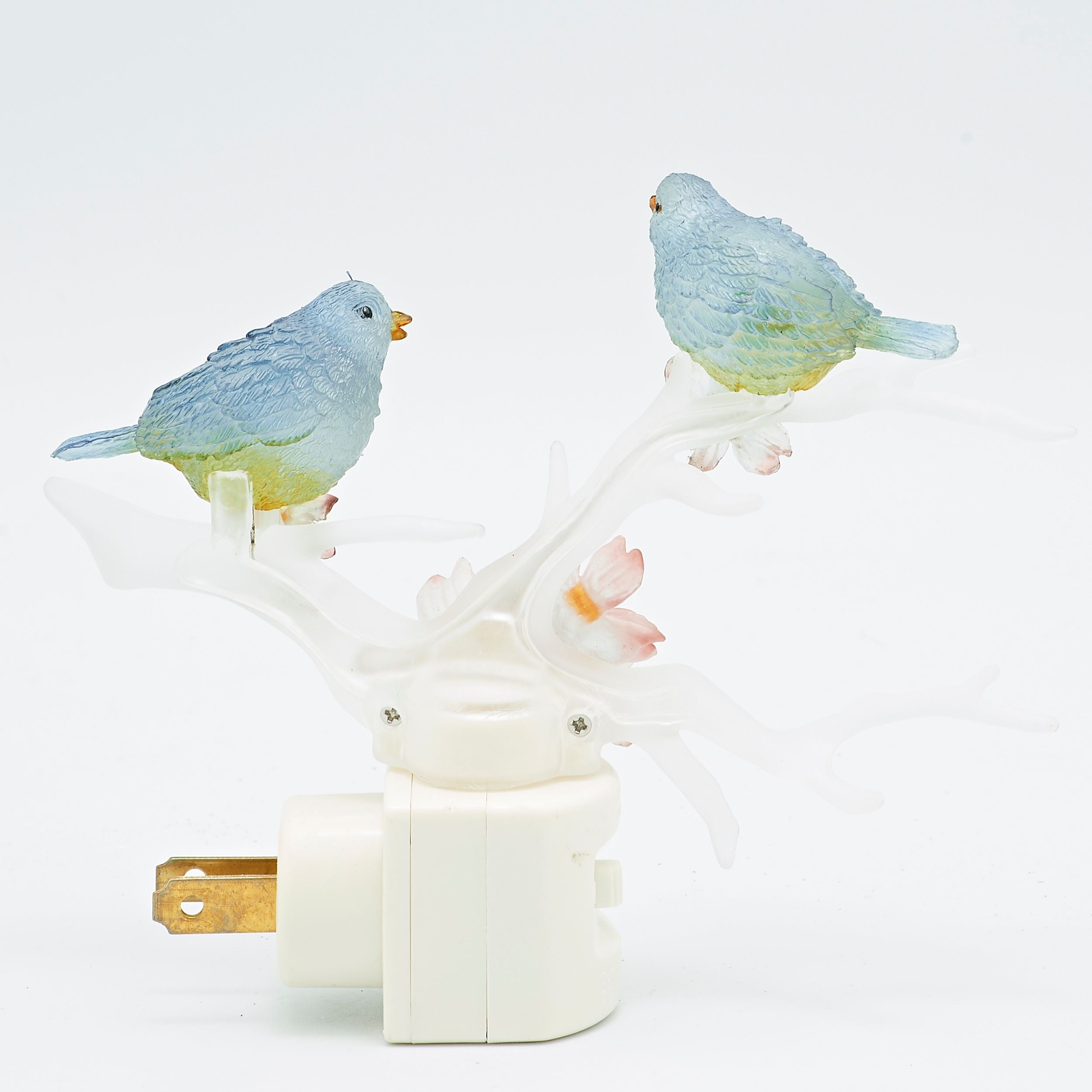 Decorative night light with bird designs on a white background