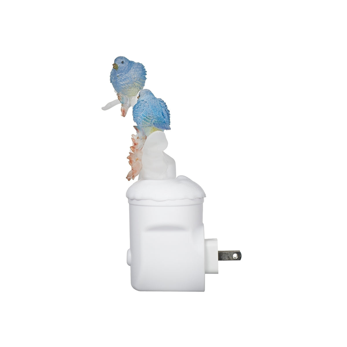 Side view of blue bird and dogwood night-light showing its white adapter base and extended plug prongs.