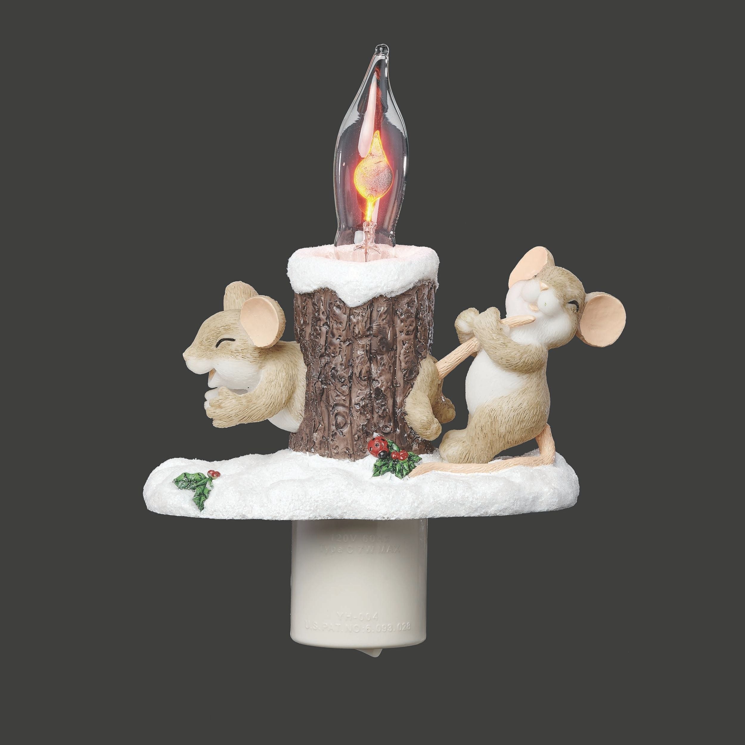 Decorative Christmas light with two mice around a log and snow on a dark background
