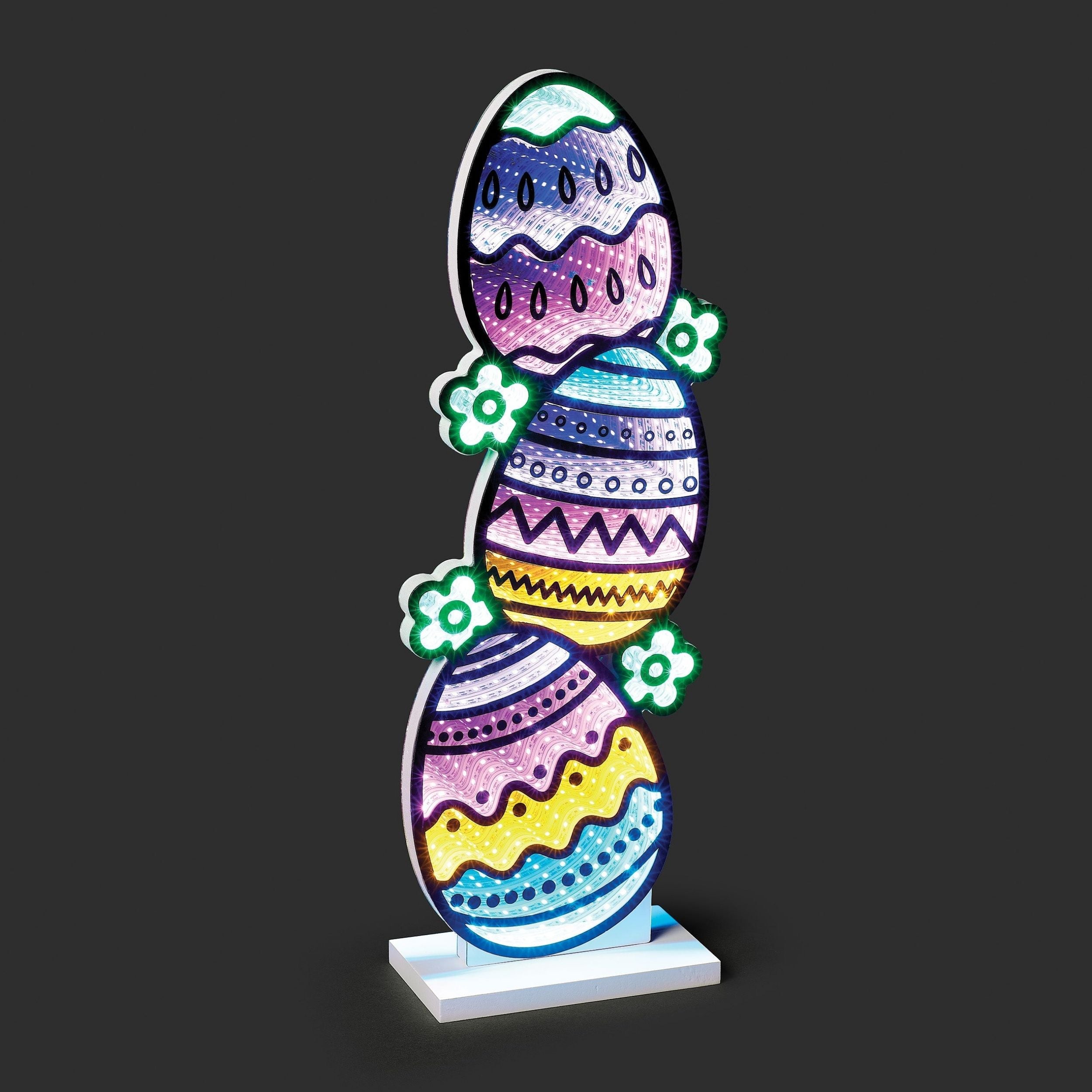 Decorative Easter egg with colorful patterns on a black background