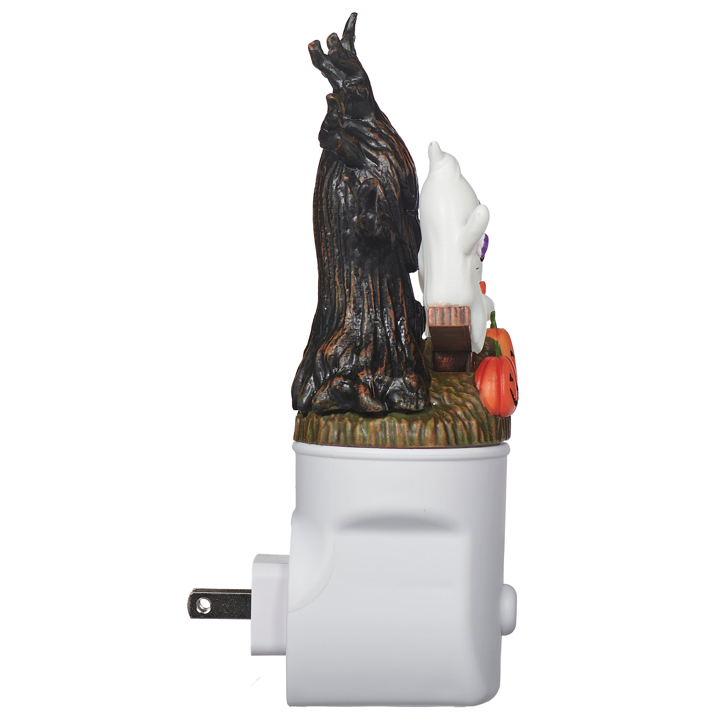 Decorative night light with a witch and pumpkin design on a white background