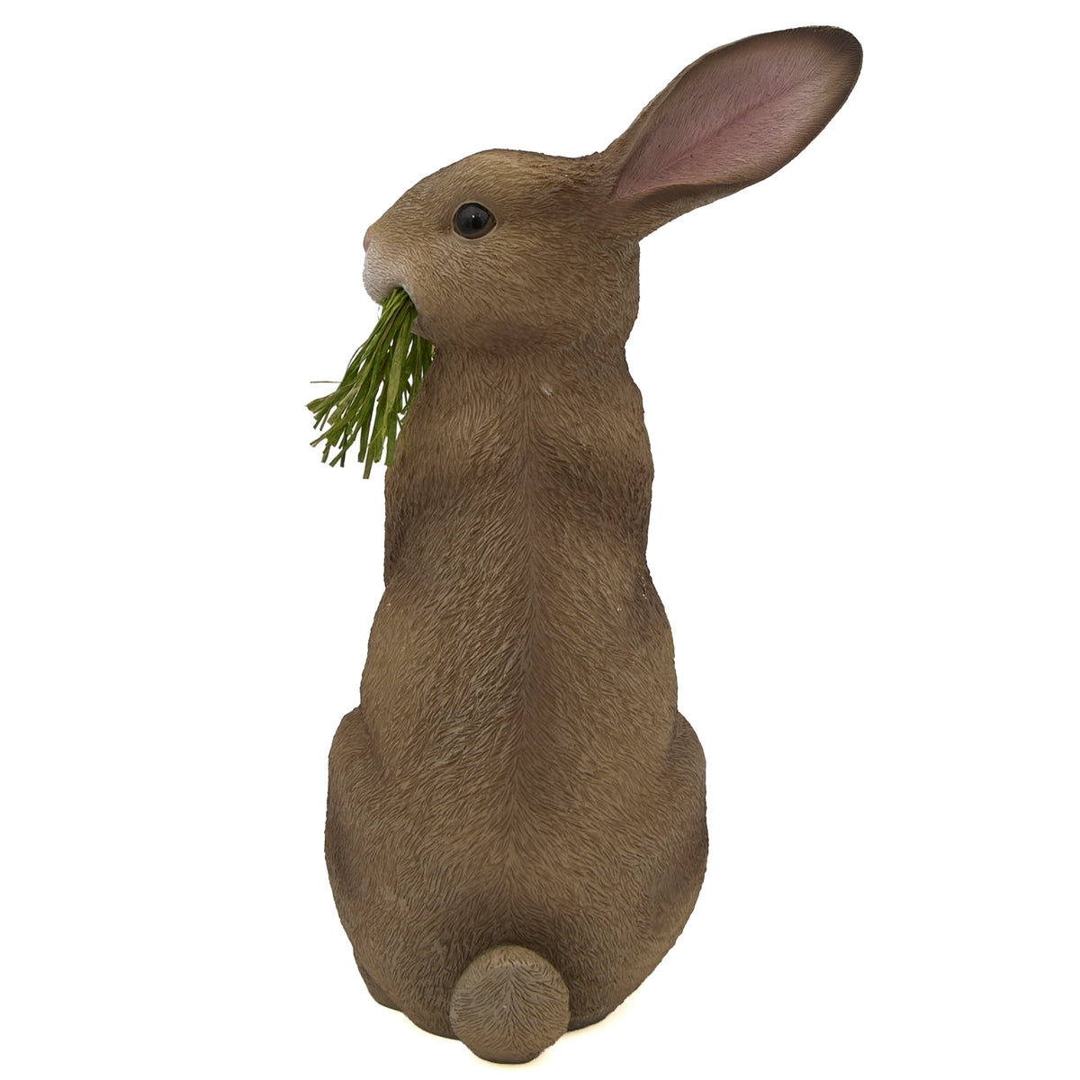 Back view of realistic Easter bunny figure with grass accent