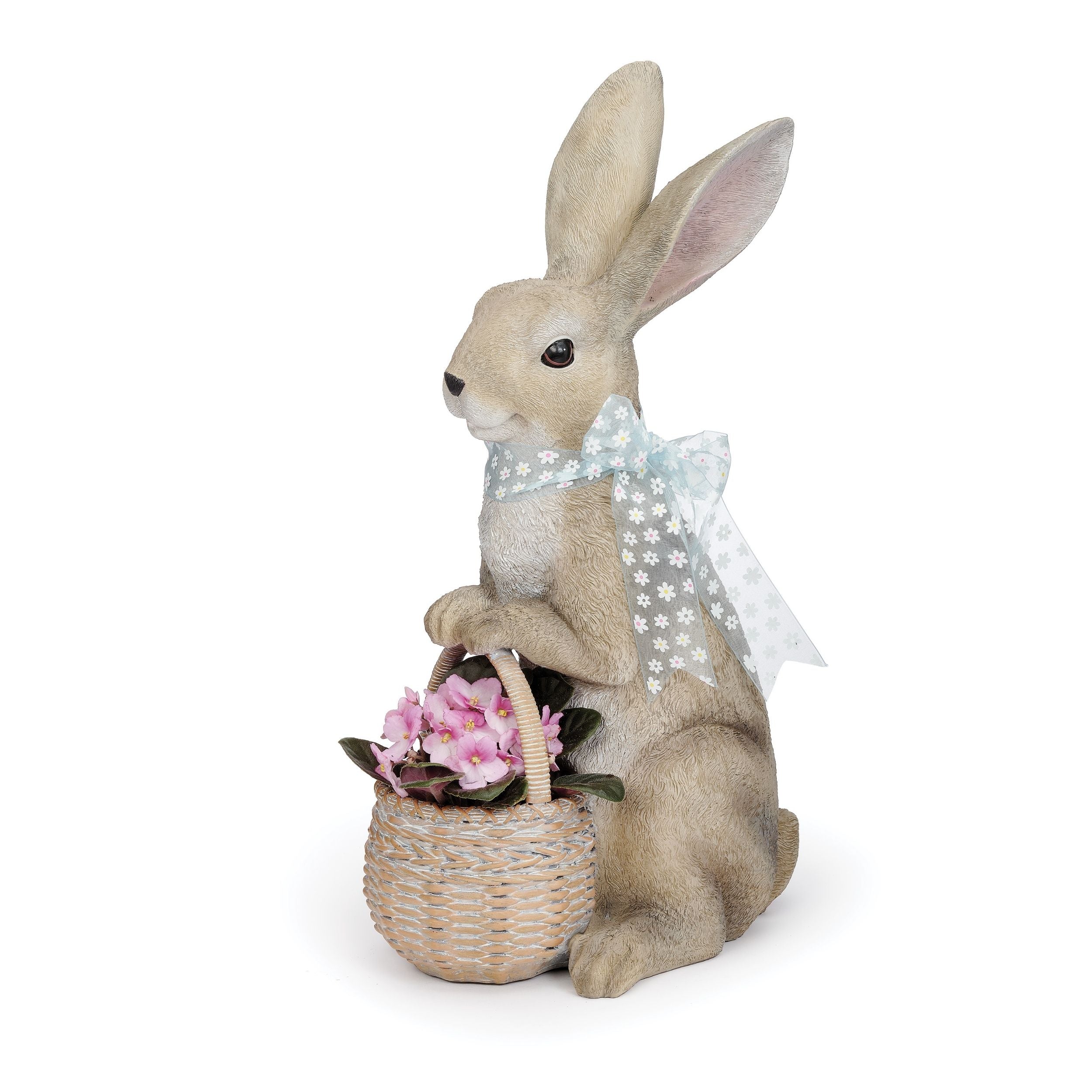 Stuffed rabbit holding a basket of flowers on a white background