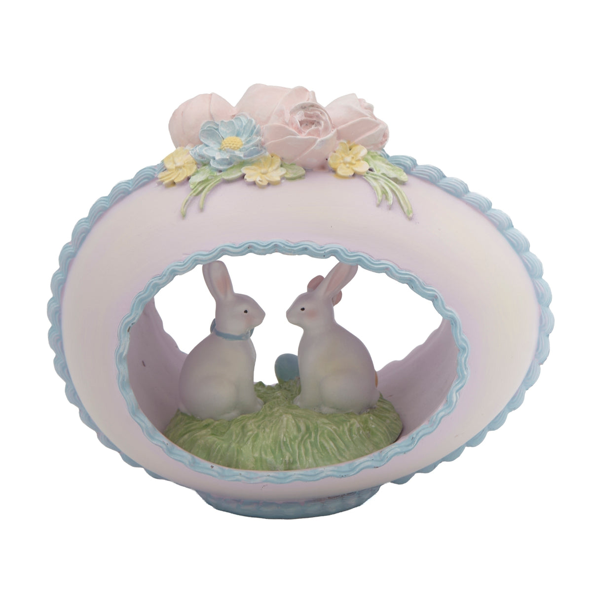Back view of Easter sugar egg figure with two bunnies and pastel floral accents