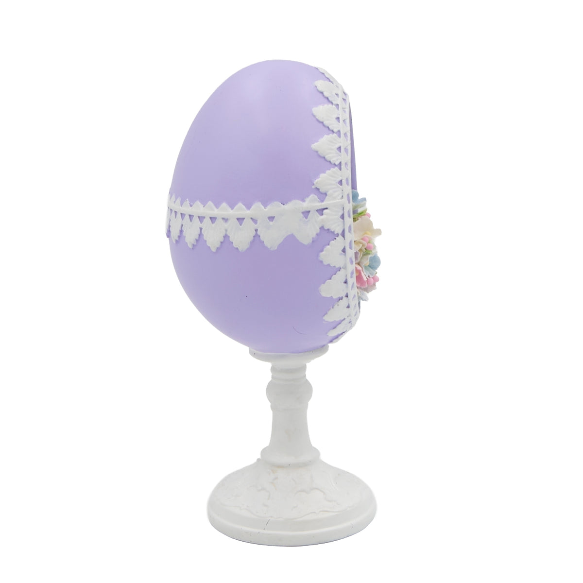 Side view of Easter sugar egg figure showing pastel flowers and chick detail
