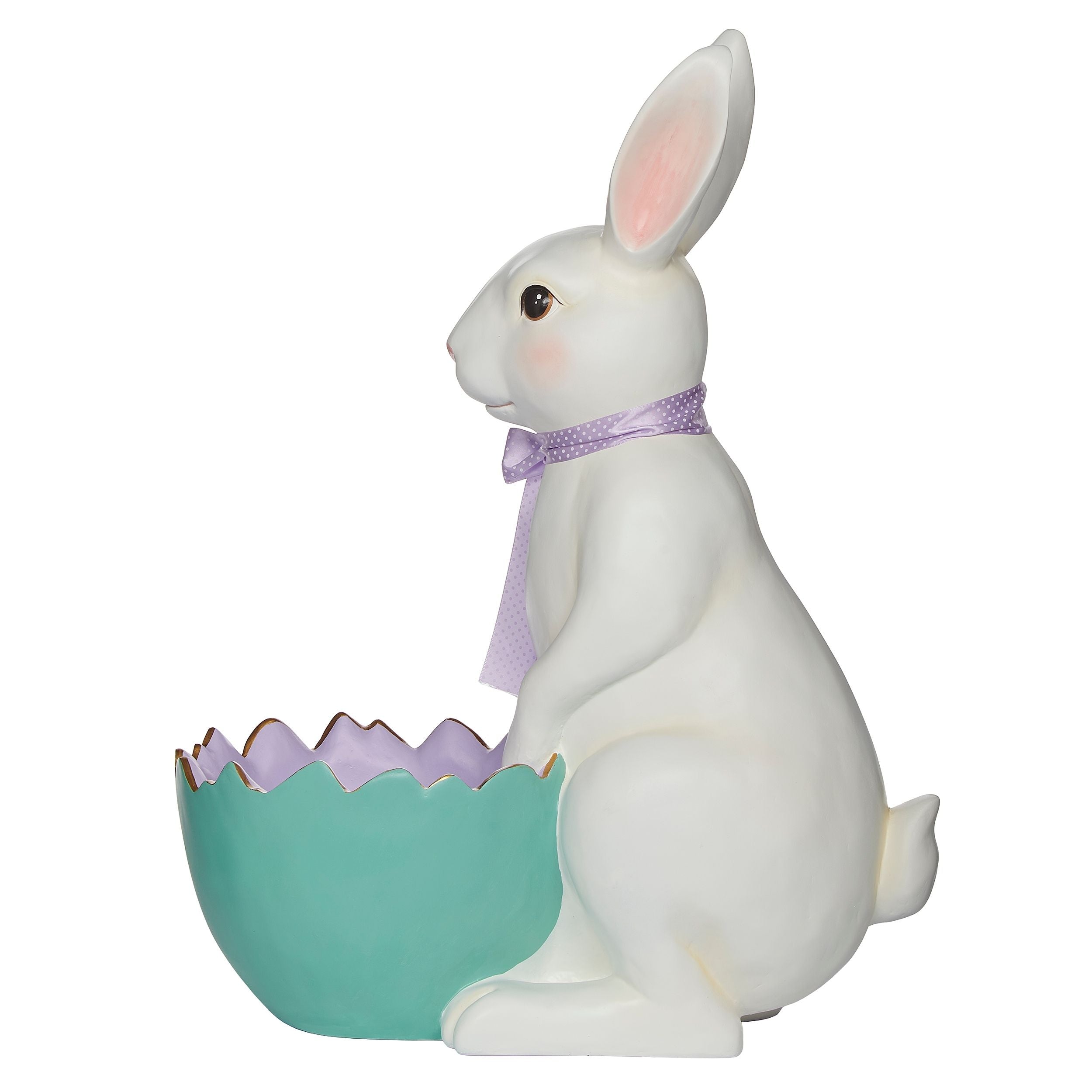 White rabbit figure with a purple bow sitting on a green egg-shaped object against a white background