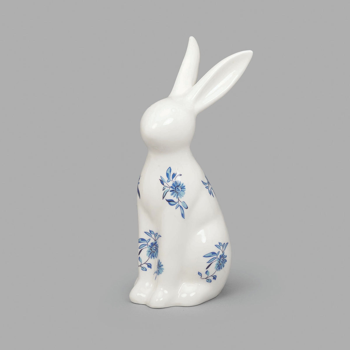 Standing Blue Willow Bunny porcelain figure with blue floral design, front view