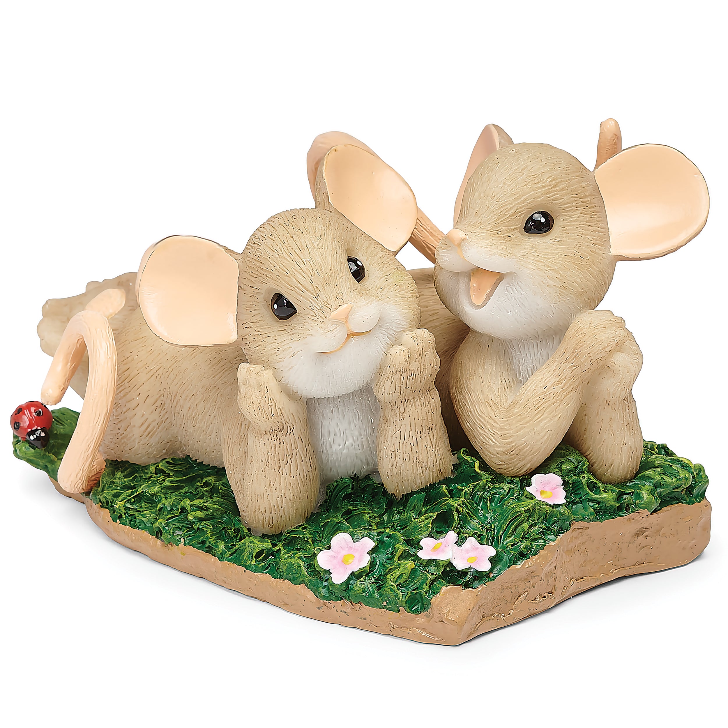 Two mouse figurines on a grassy base with flowers and a ladybug.