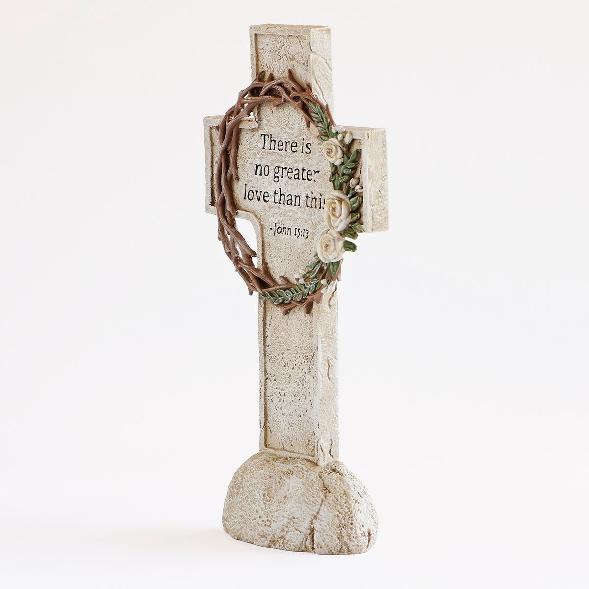 Front view of Crown of Thorns cross showing the scripture framed by thorny branches and white roses.