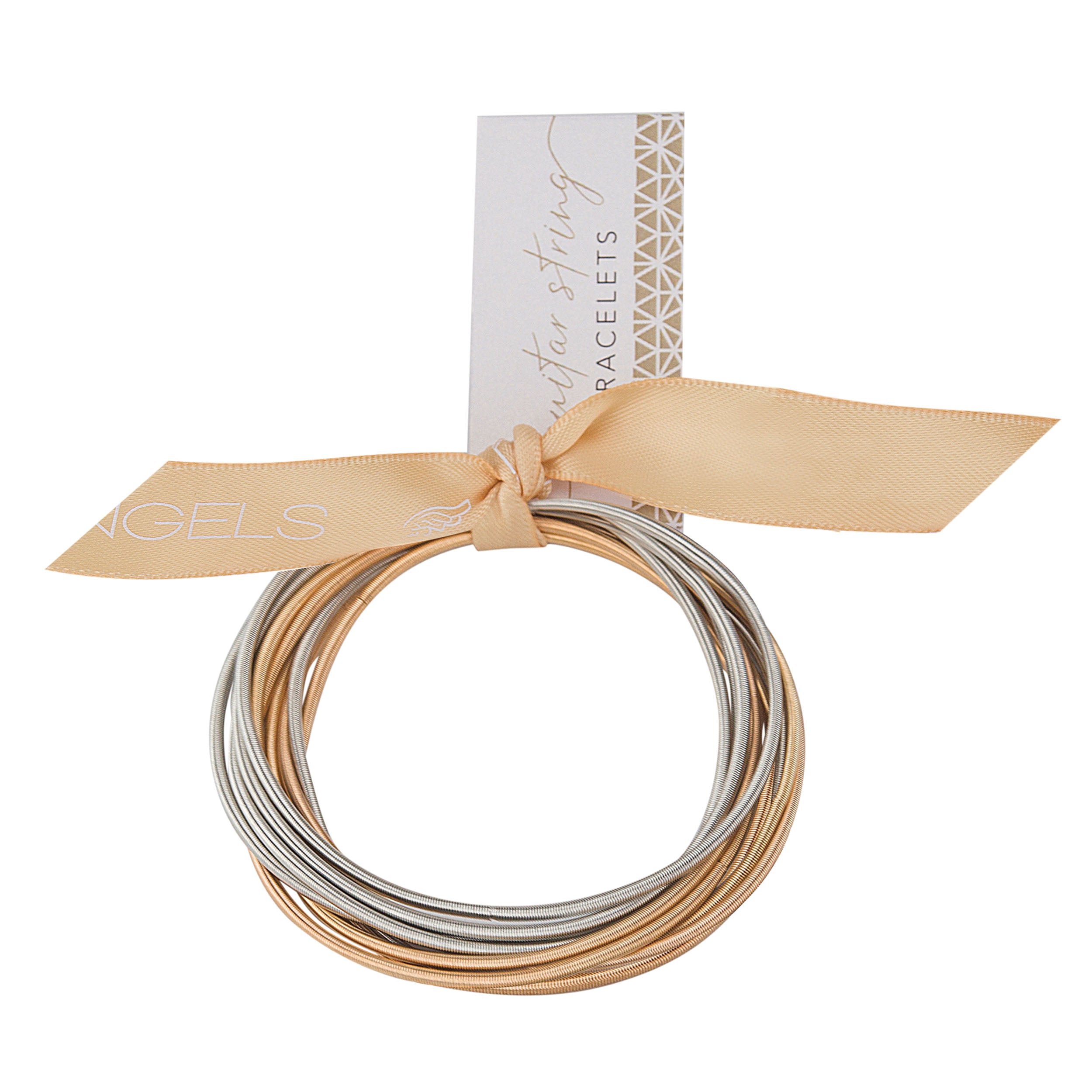 Set of silver and gold bracelets tied with a beige ribbon on a white background