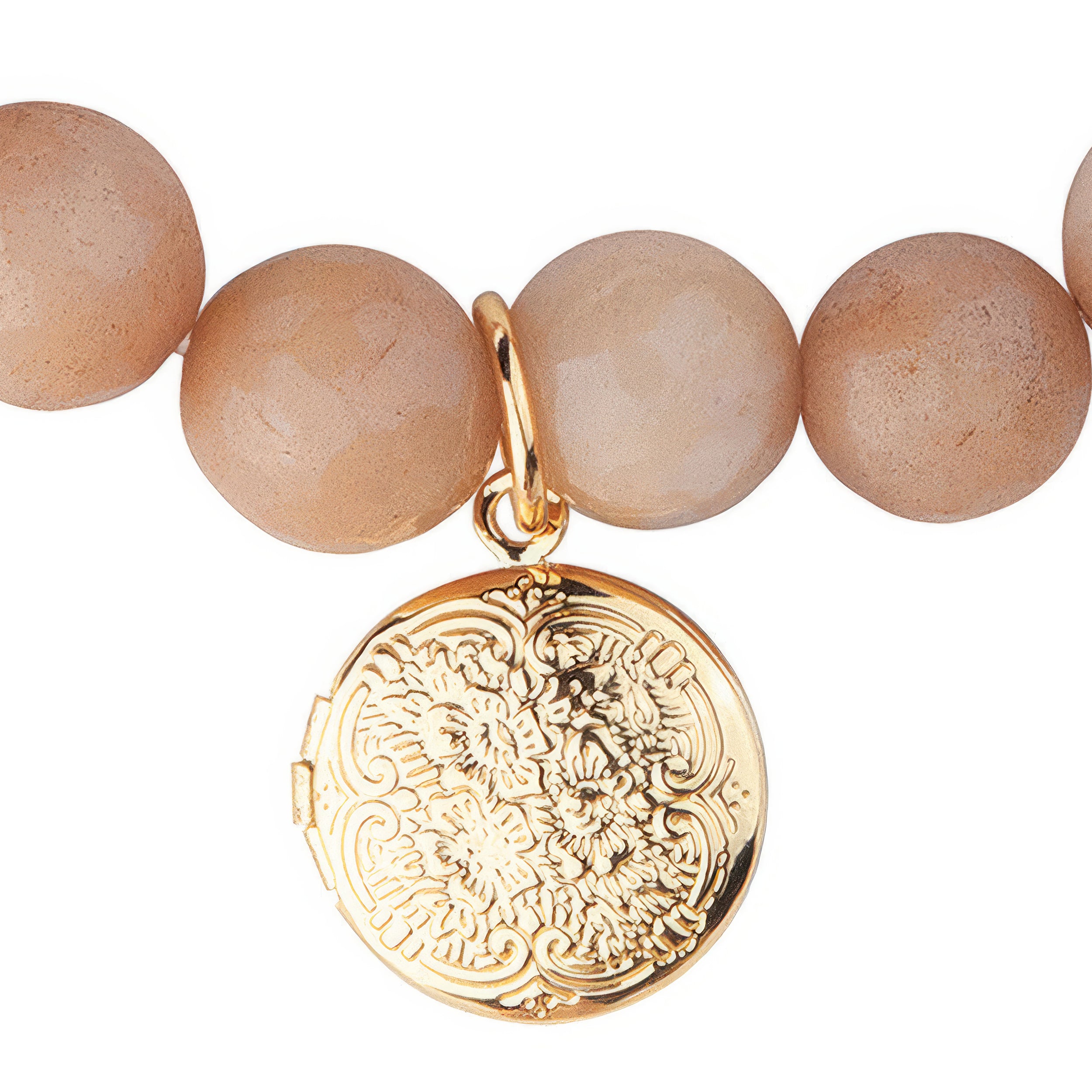 Bracelet with peach beads and a gold locket on a white background