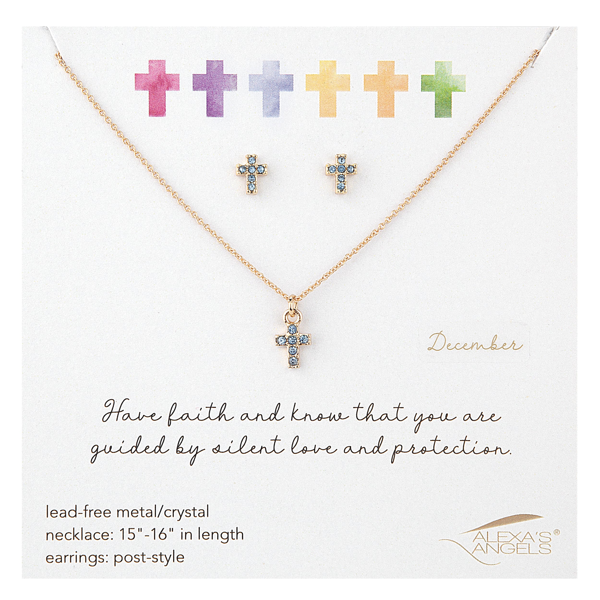Jewelry set with cross necklace and earrings on a white card with text and brand logo.