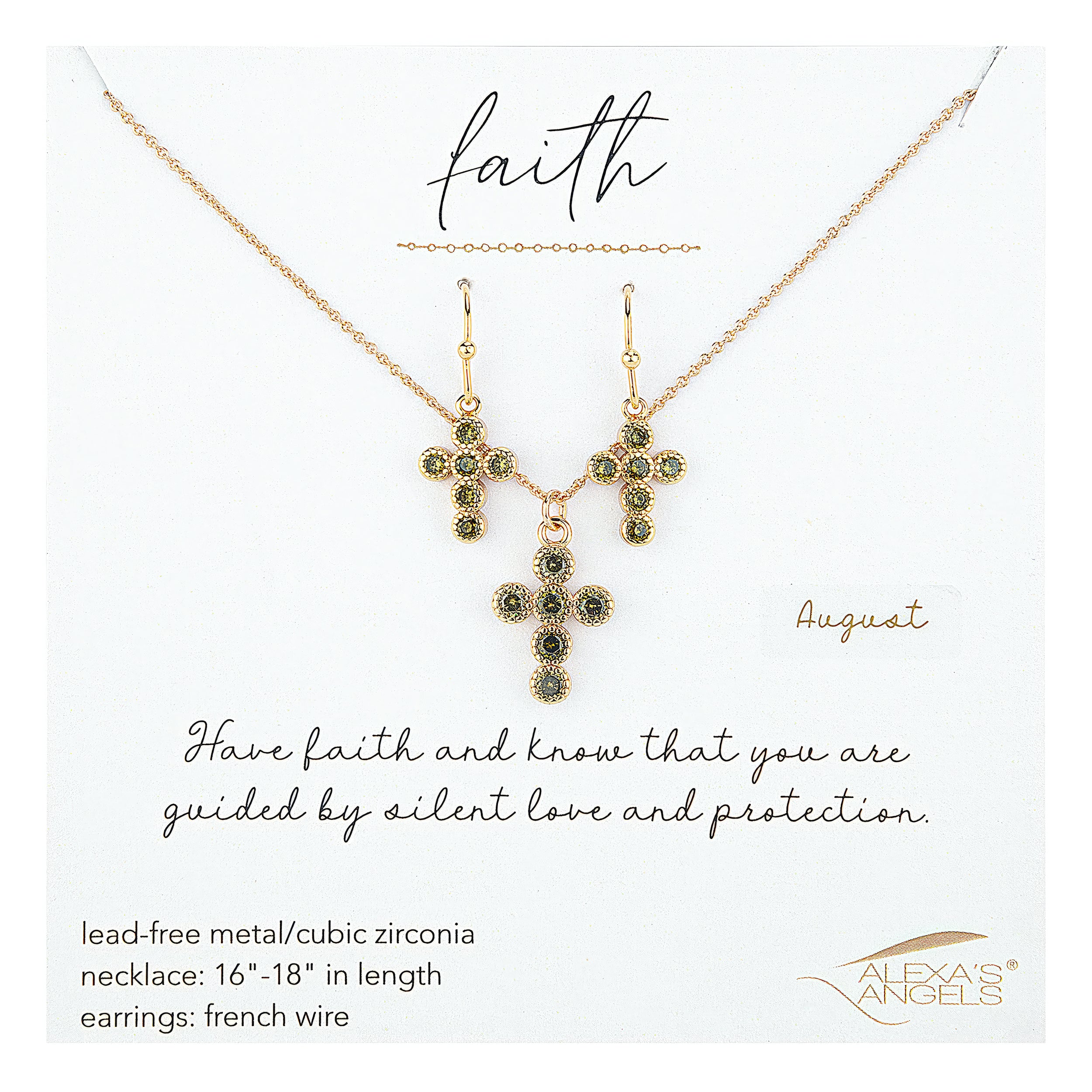 Gold cross necklace and earrings with green gemstones on a white card, featuring the brand 'Alexas angels'.