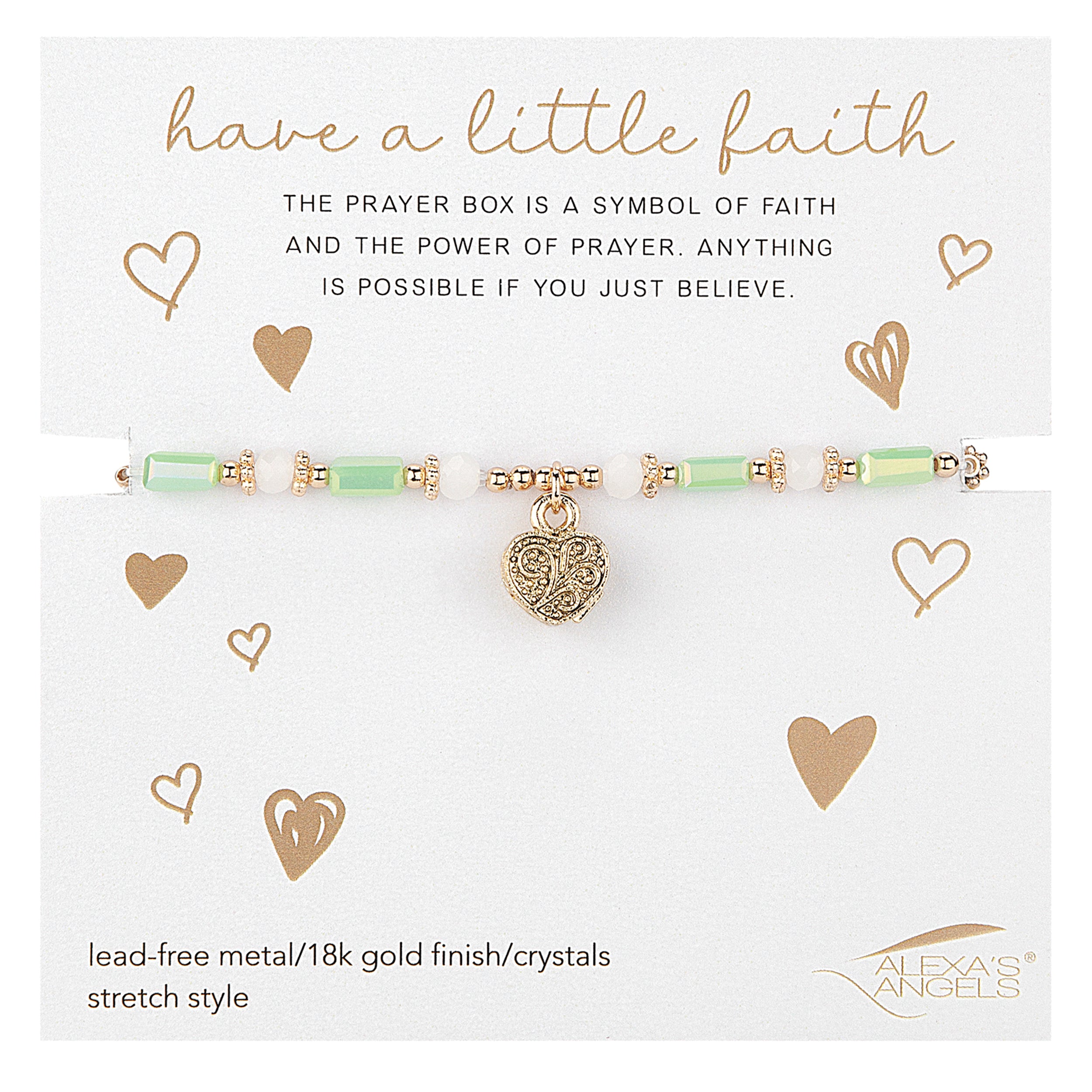 Gold and green bracelet with a heart charm on a white card with text about faith and prayer.