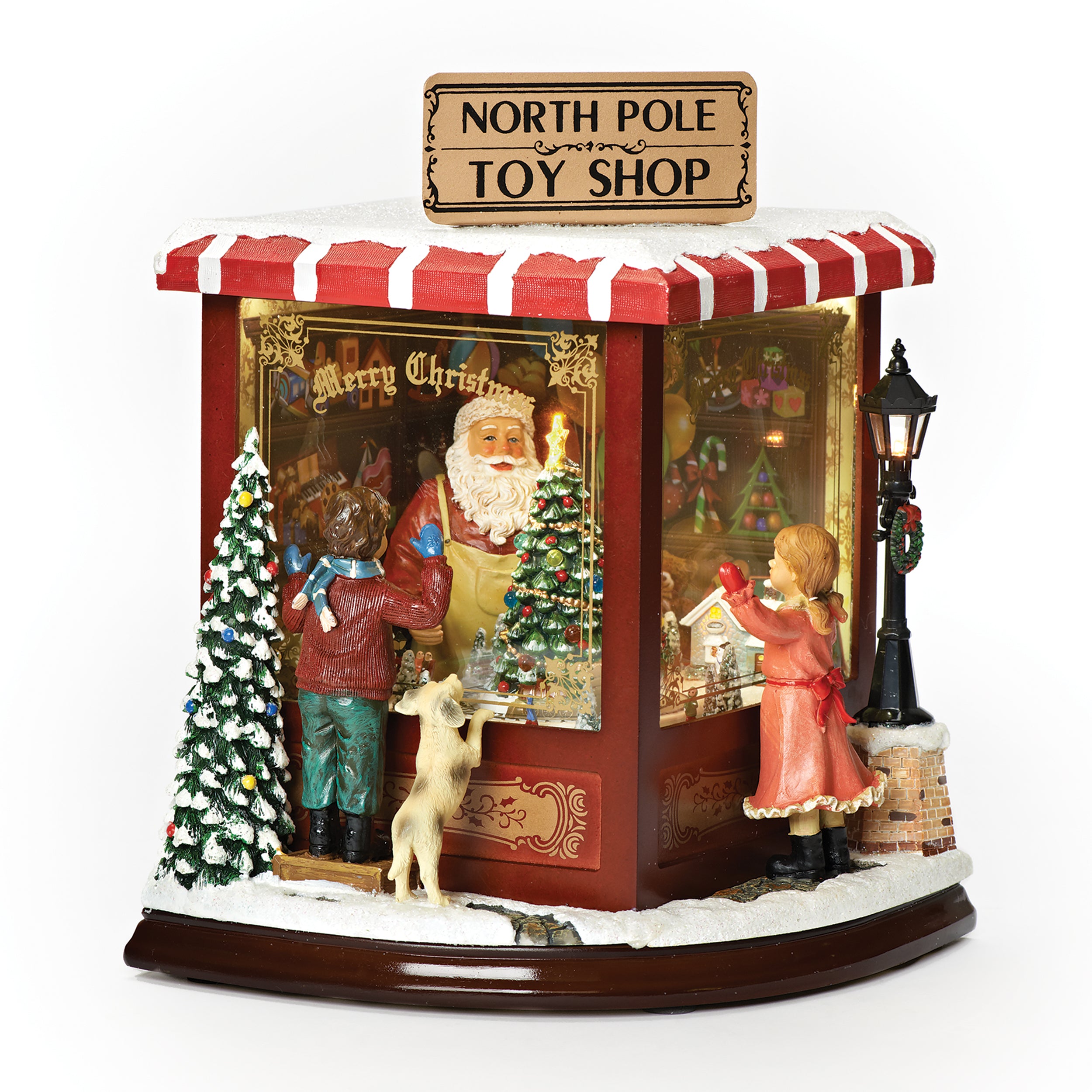 Amusements North Pole Toy Shop Lighted Musical Rotating Train Village Scene - 10" H