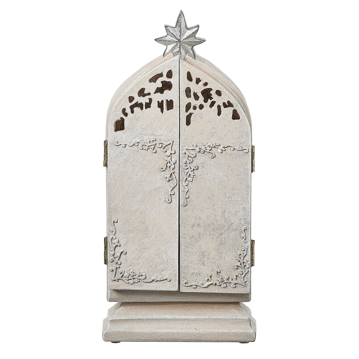 Closed view: Closed view of Ivory Holy Family Triptych showing the tall arched ivory panels with intricate cutout Bethlehem city details and star topper