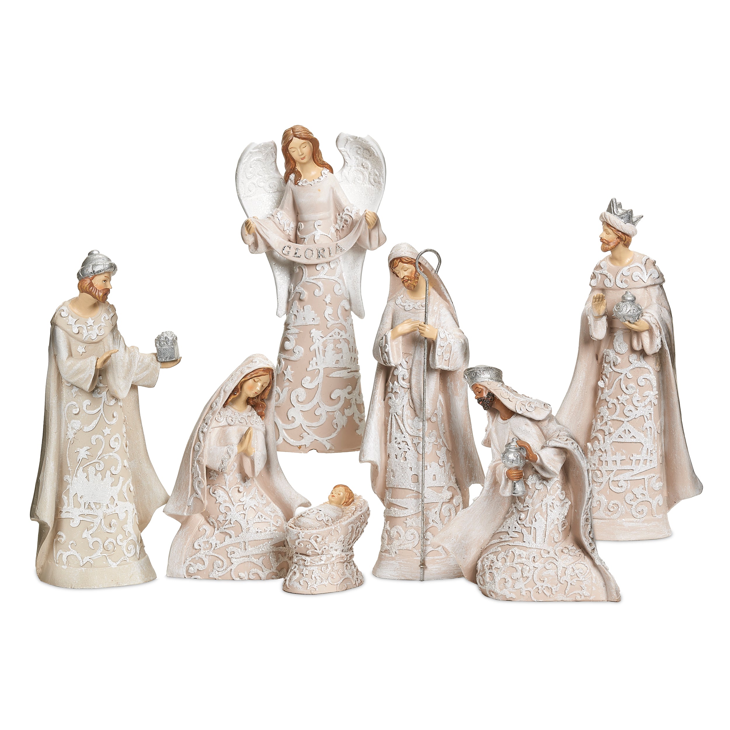 Decorative nativity figurines with intricate designs on a white background