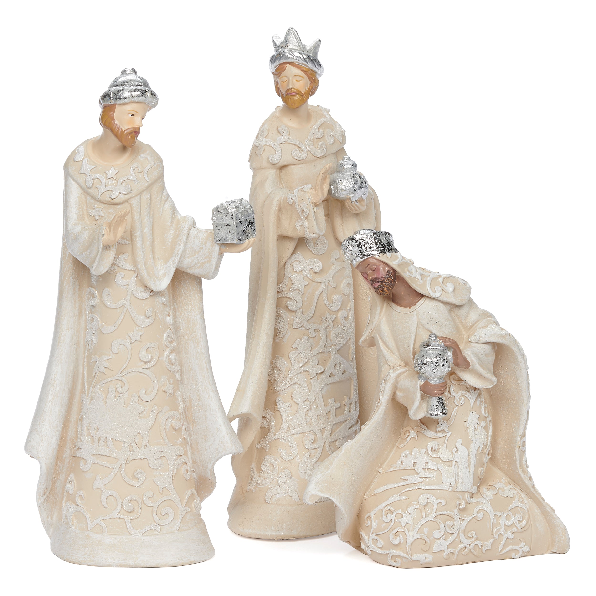 Decorative nativity figurines of the three kings on a white background