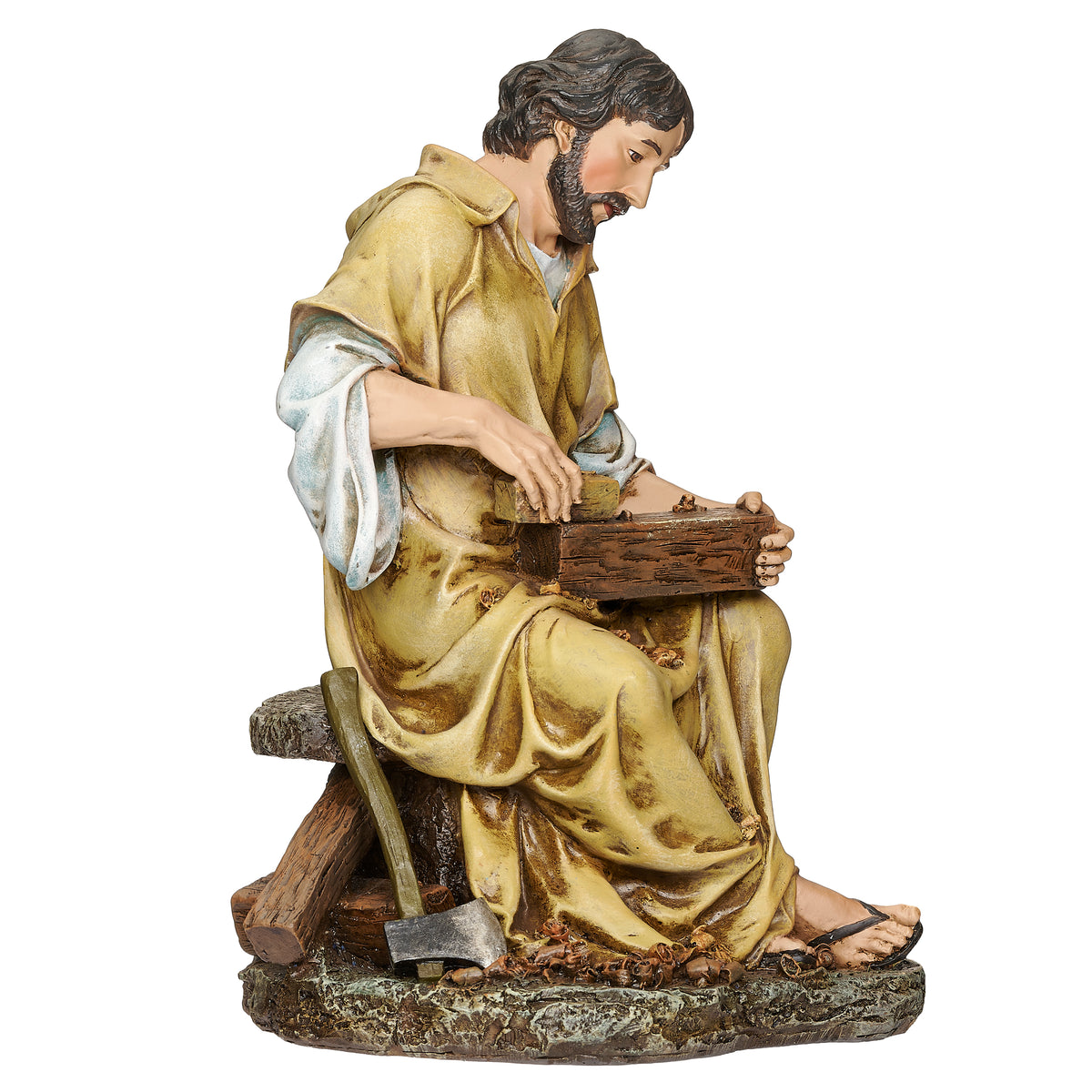 Side view of Joseph's Studio St. Joseph the Carpenter Figure showing St. Joseph seated and focused on the woodwork in his hands