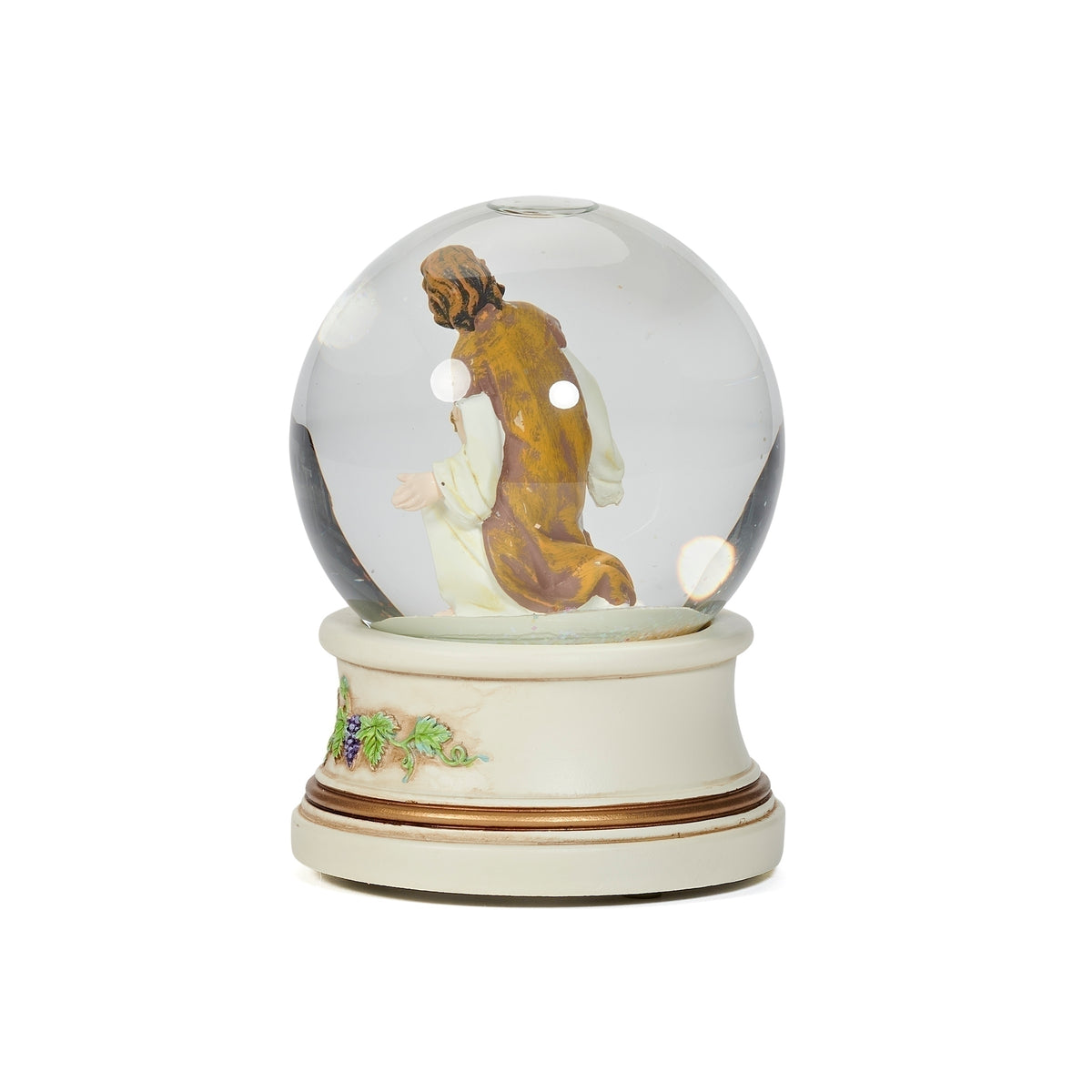 Rear angled view of First Communion musical glitterdome showing Jesus and the girl from behind inside the glass globe