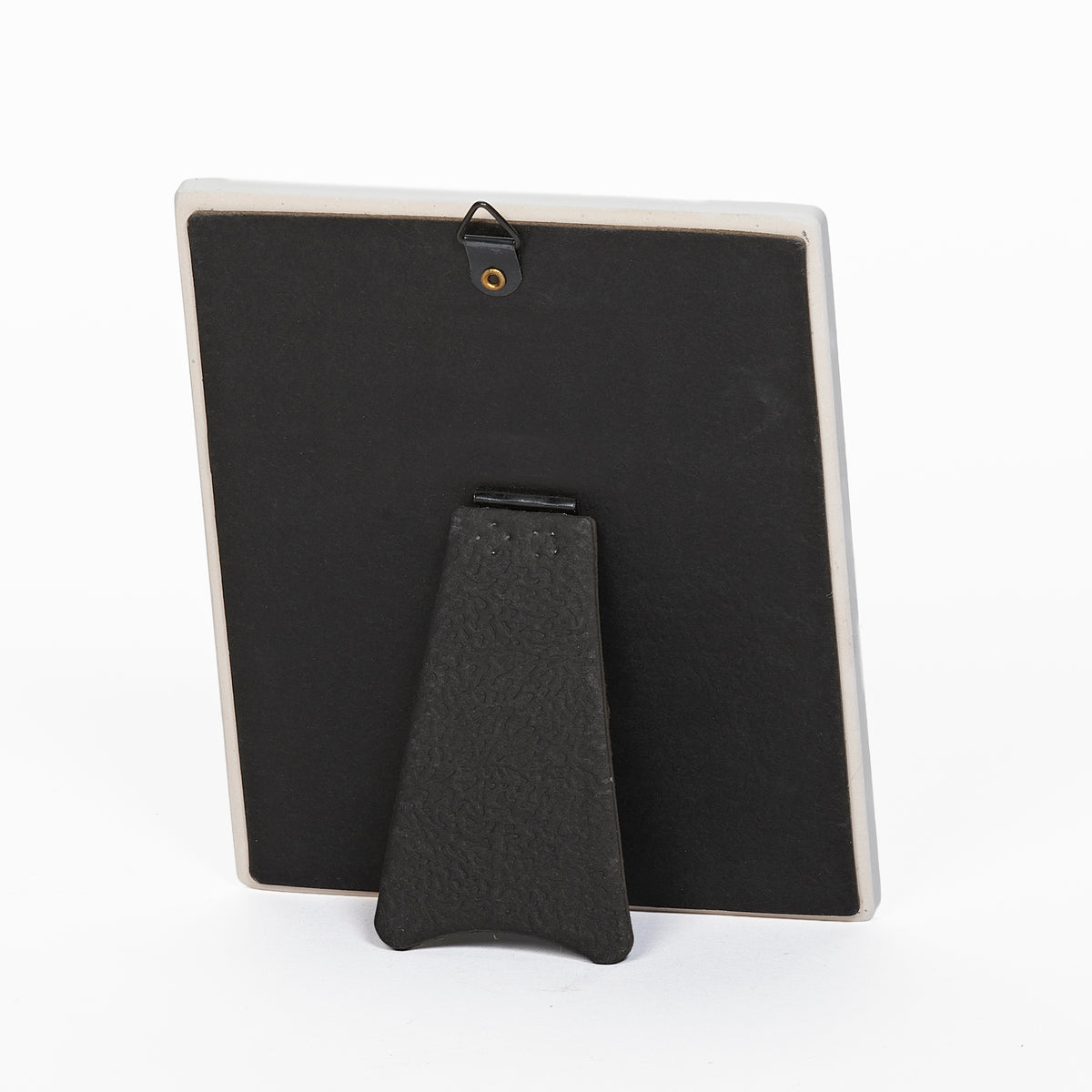 Back view of Lord's Prayer Wall Plaque showing the black easel stand for tabletop display