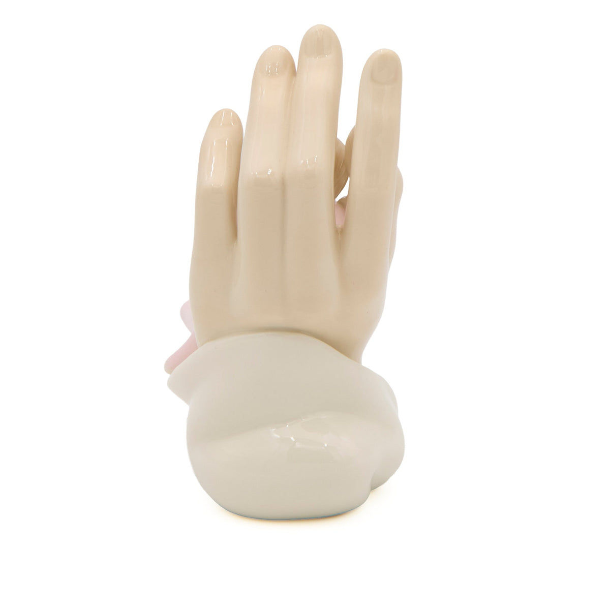 Back view of pink Safe in His Hands Figure showing the sculpted ivory hand and soft pink gown