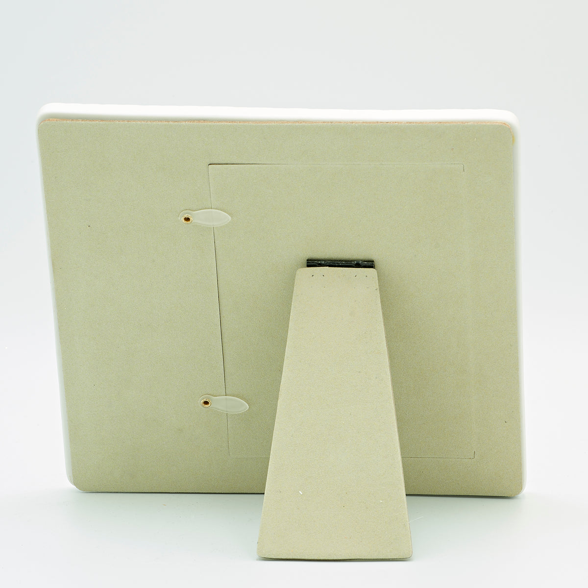 Back view of My First Communion Quilted Chalice Emblem Picture Frame showing the light-colored backing and fold-out tabletop easel stand